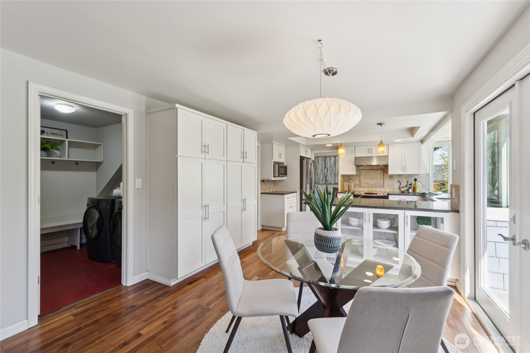 Another view shows its connection to the kitchen and outdoors—light, bright, and peaceful.