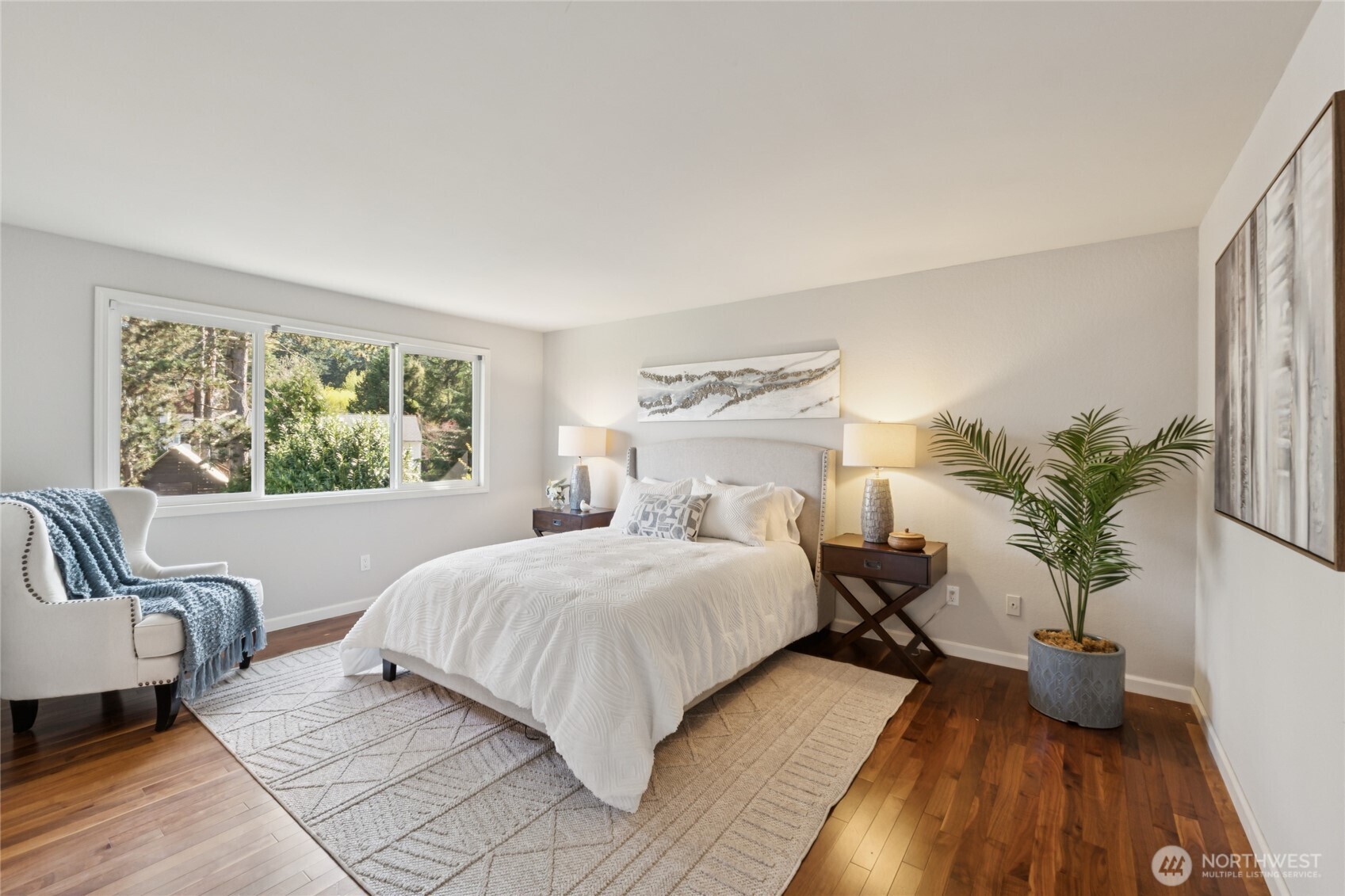 The primary bedroom offers a quiet retreat—comfortable, light-filled, and oversized!