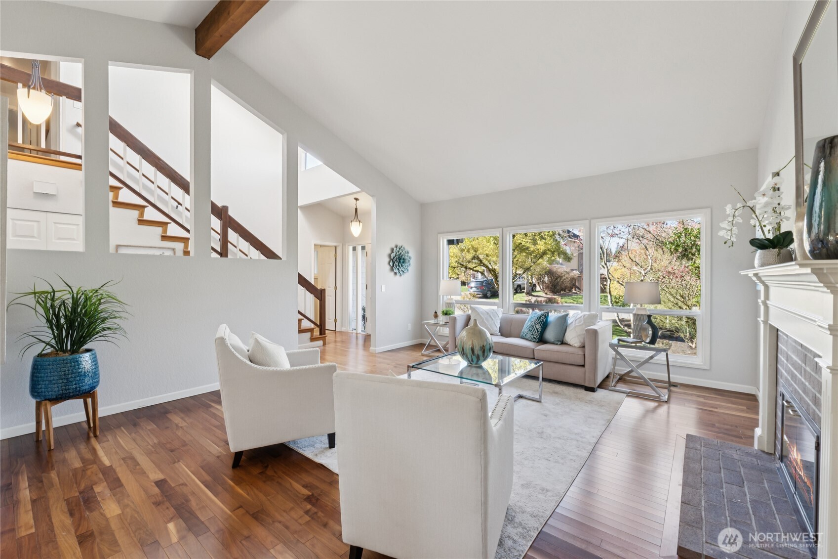 Warm hardwood floors brings you through the spaces—grounding this home with comfort and livability.