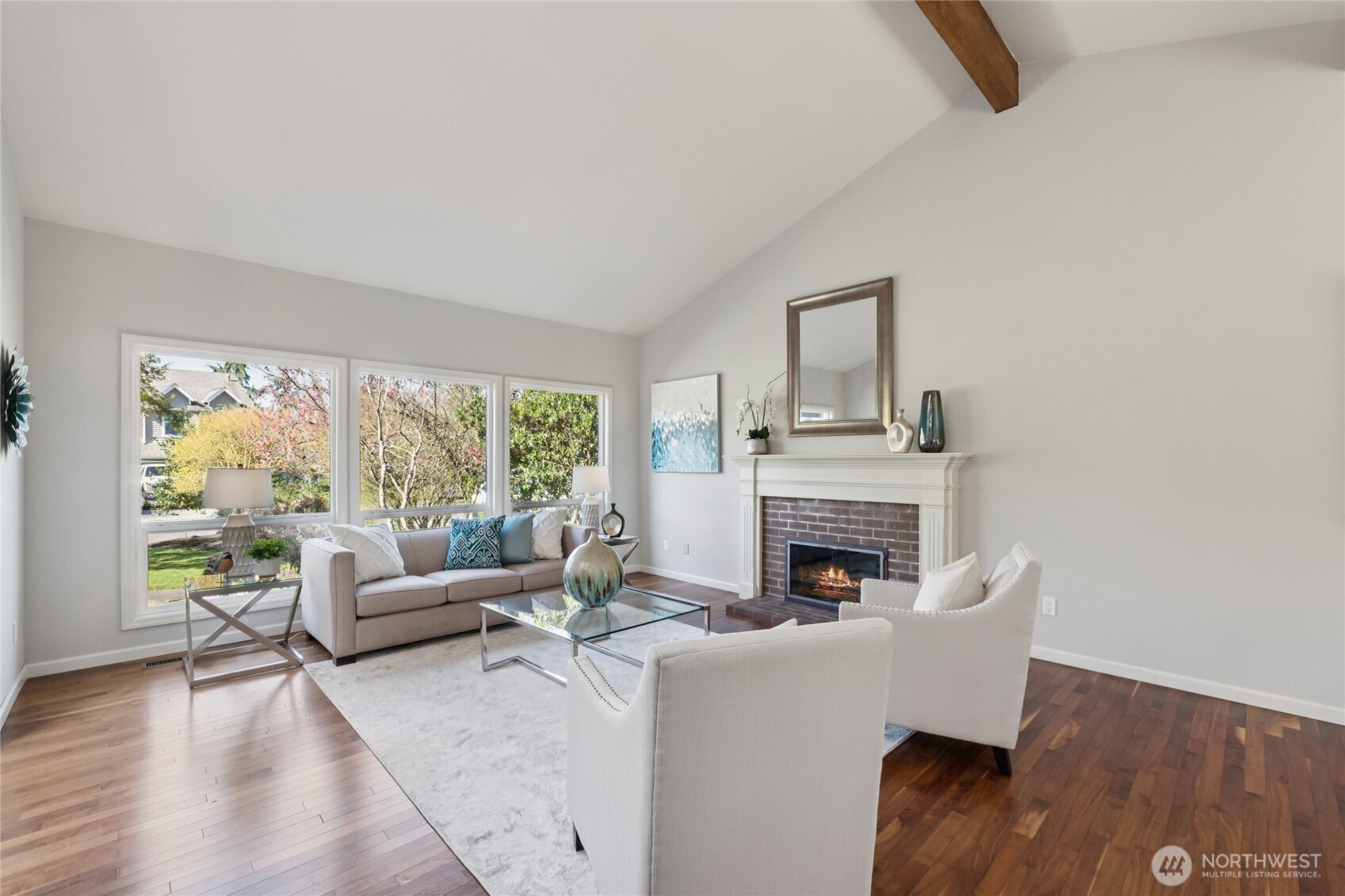 Walls of windows bring the outdoors in, filling the space with natural light and a calm, open feel.