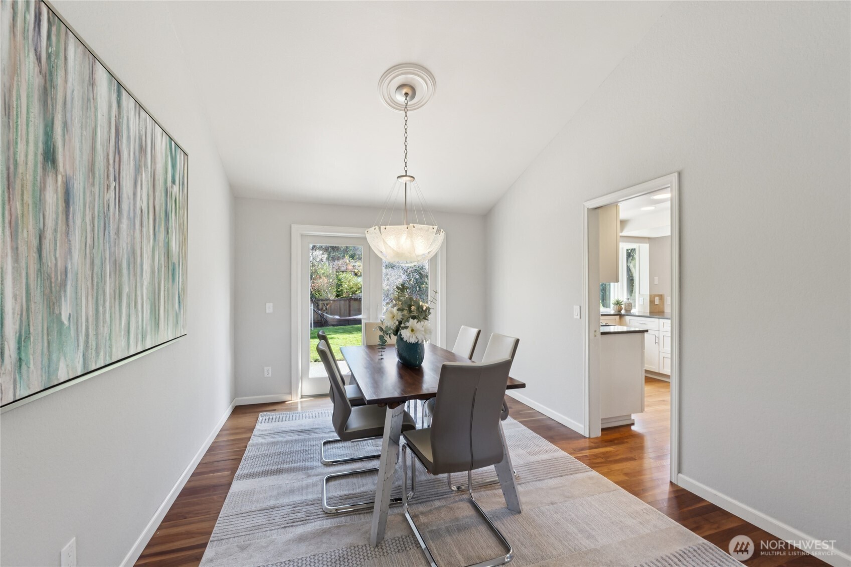 If these walls could talk ... this dedicated dining space connects easily to the kitchen, with French doors that open out to the backyard.
