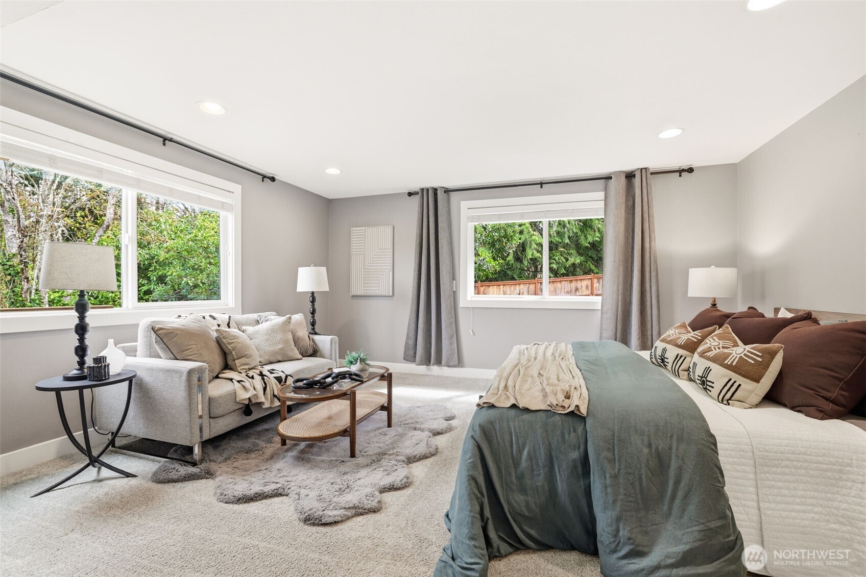 Comfortable primary with natural light and peaceful outlook