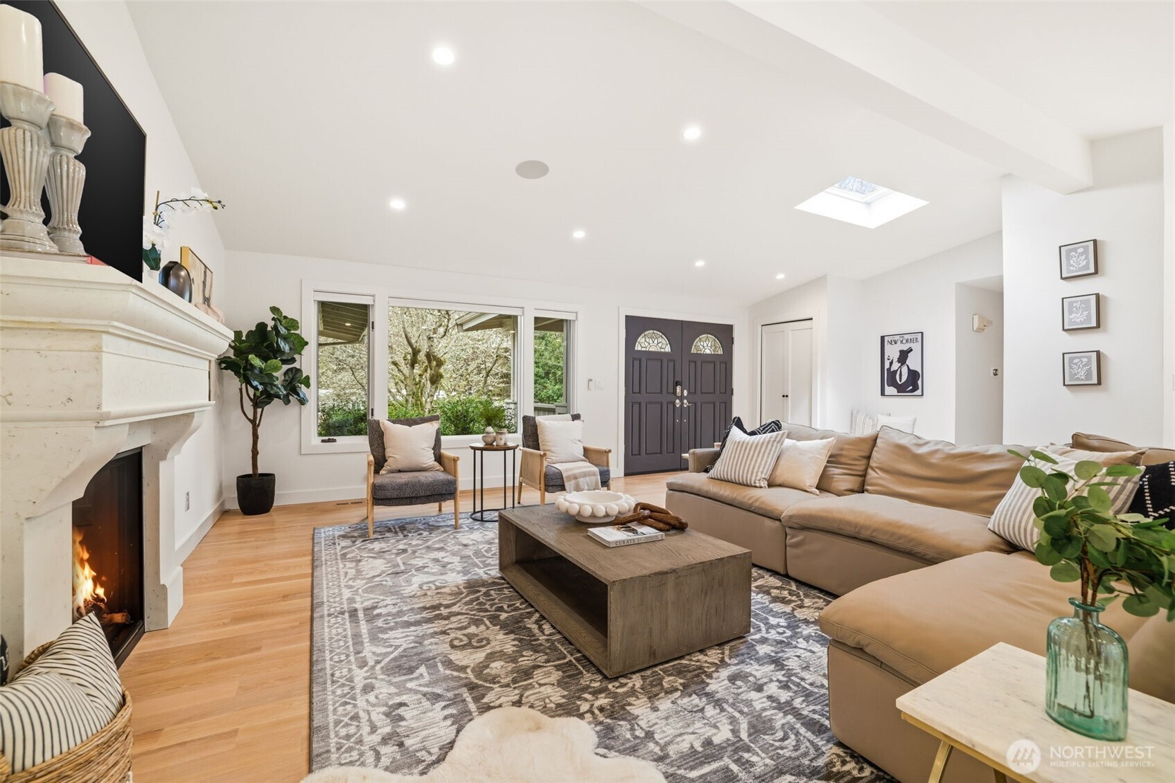 Cozy gathering space with fireplace and natural light throughout