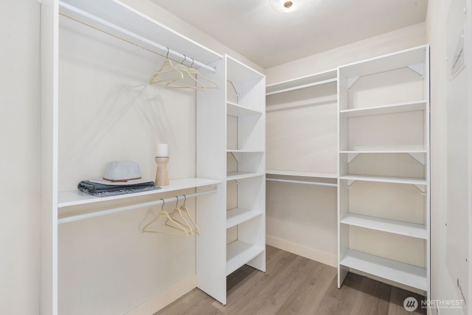 A partial view of the walk-in closet in the primary.