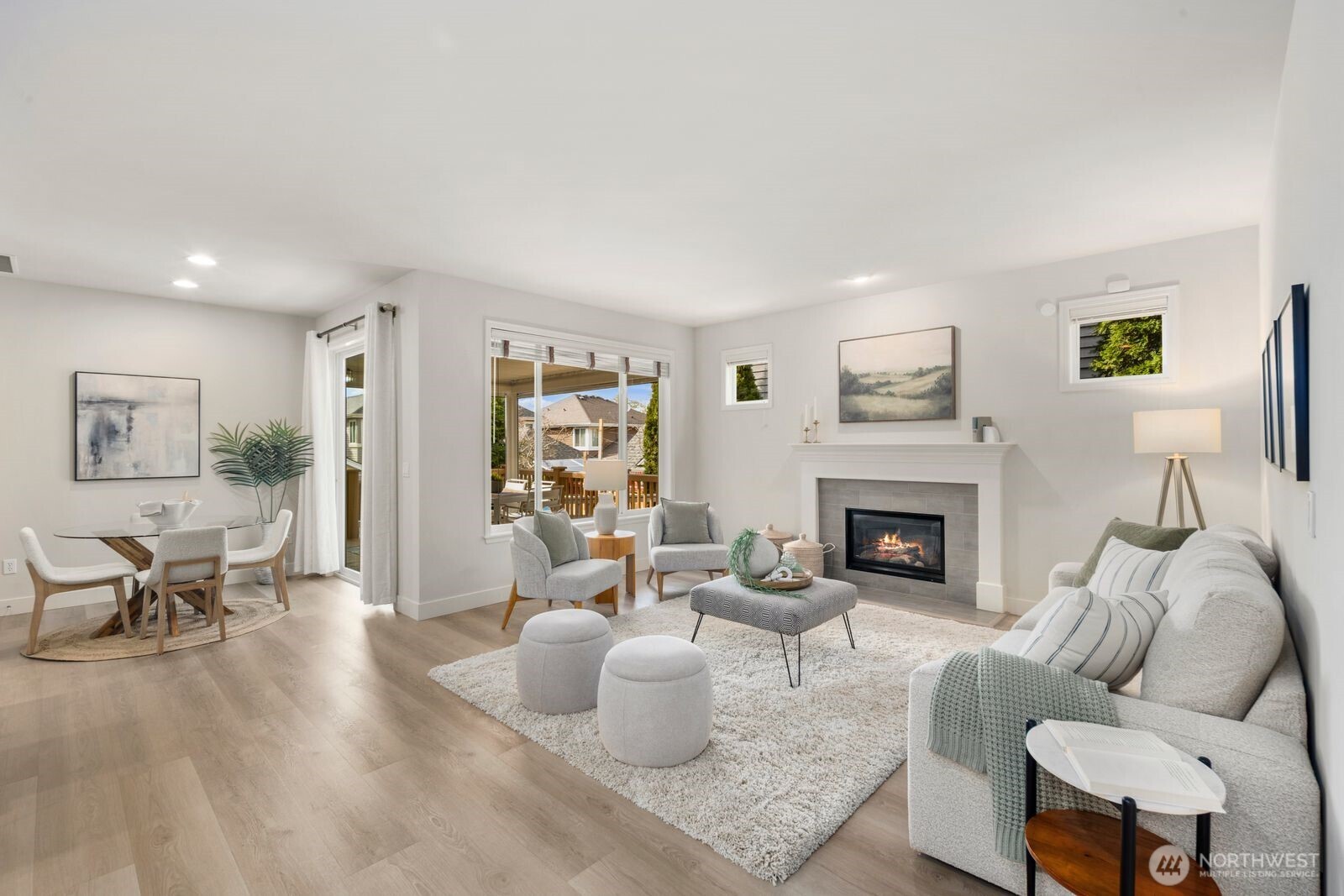 Great room, with kitchen, living room, informal dining area, and a view of the back deck.