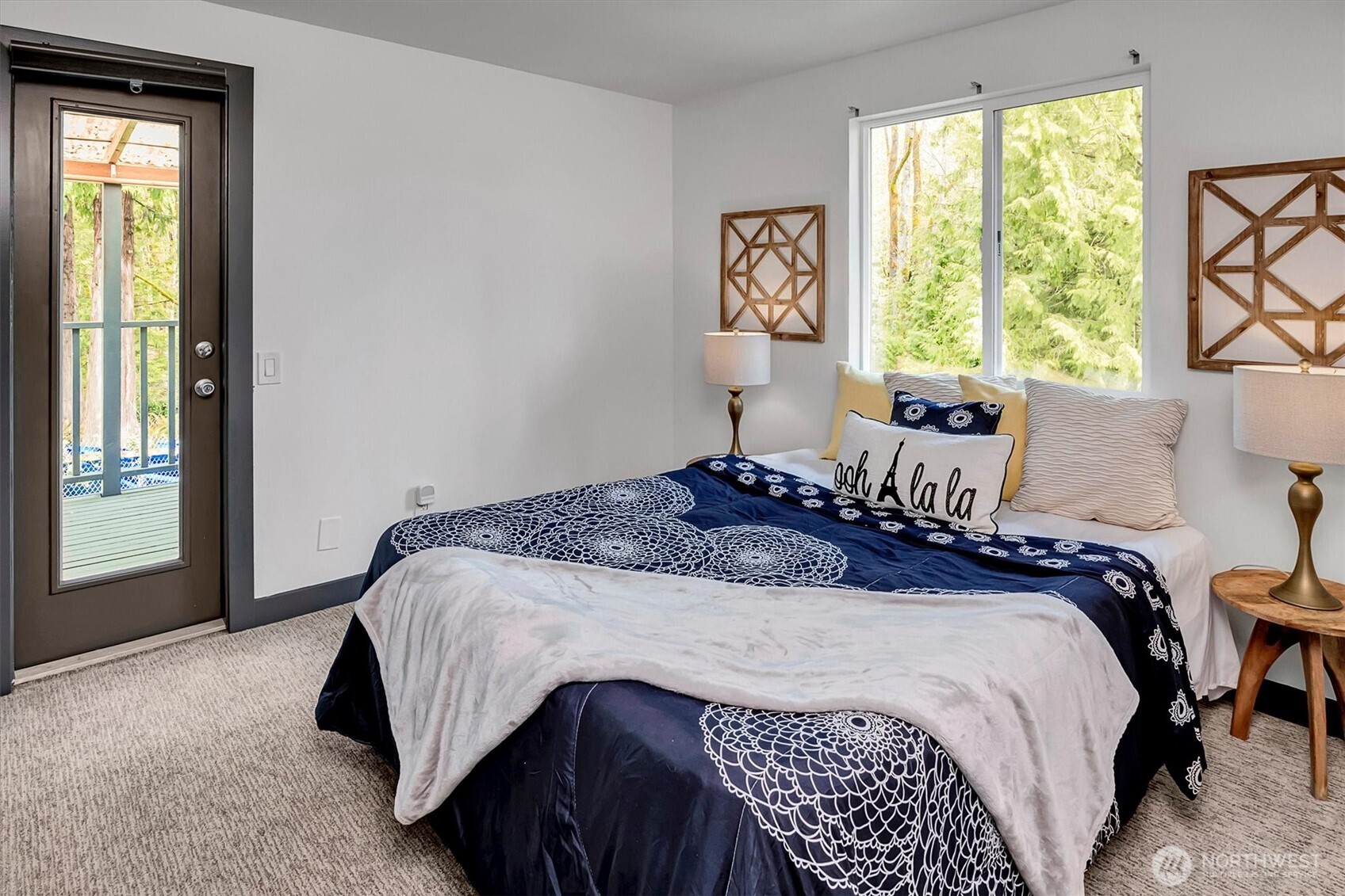 The primary bedroom offers private access to a second covered deck.