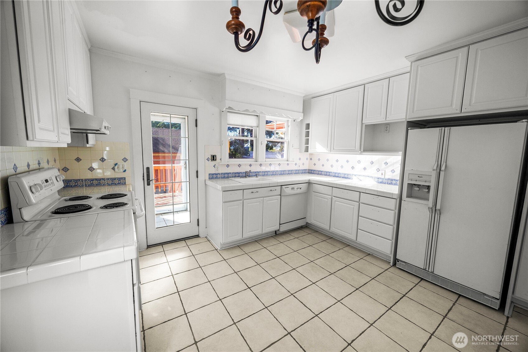 Will you keep the kitchen in its current form or will you get creative and create a masterpiece?  Single door leads to mud room which then leads to back deck and yard.