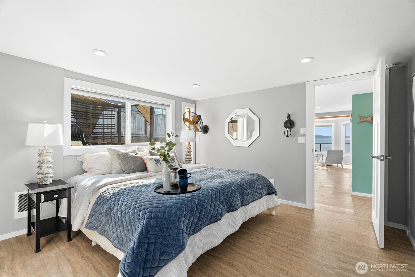 Inviting bedroom retreat, blending comfort and coastal charm.