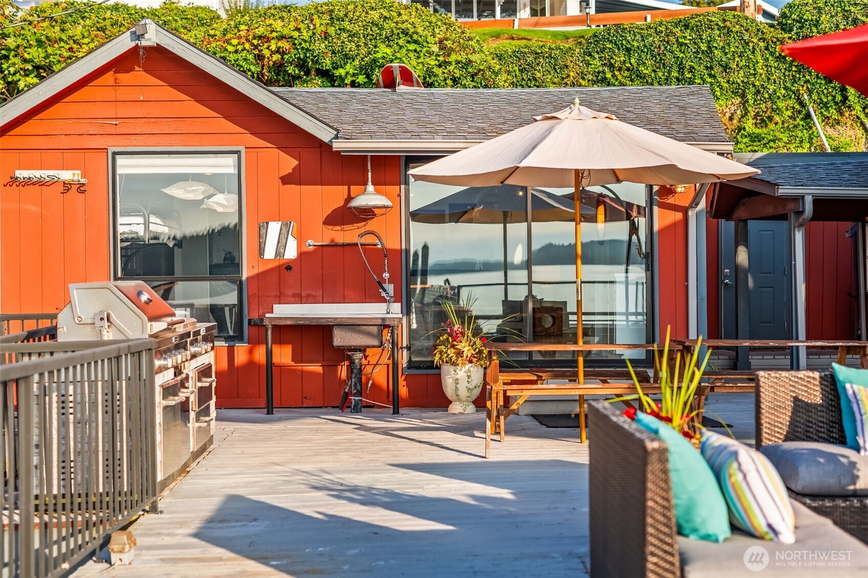 Outdoor kitchen and dining spaces make entertaining on the deck easy and unforgettable.