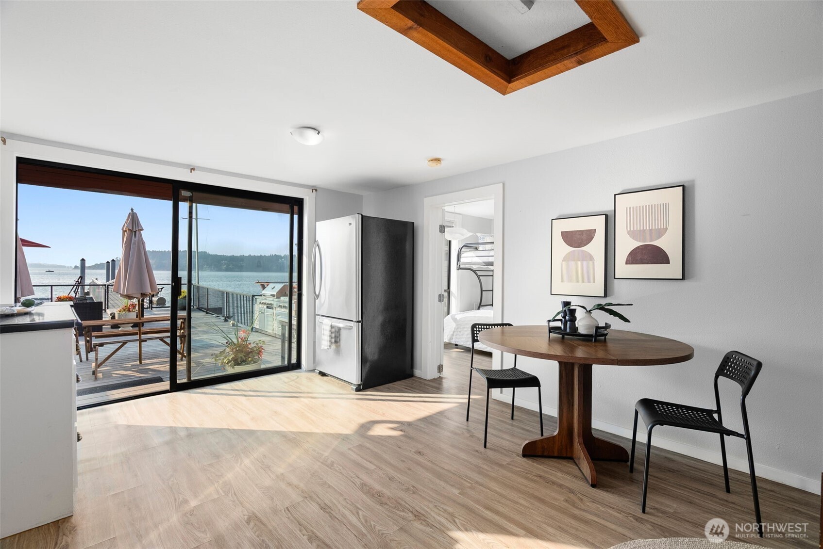 Casual dining nook with views to the deck and water beyond