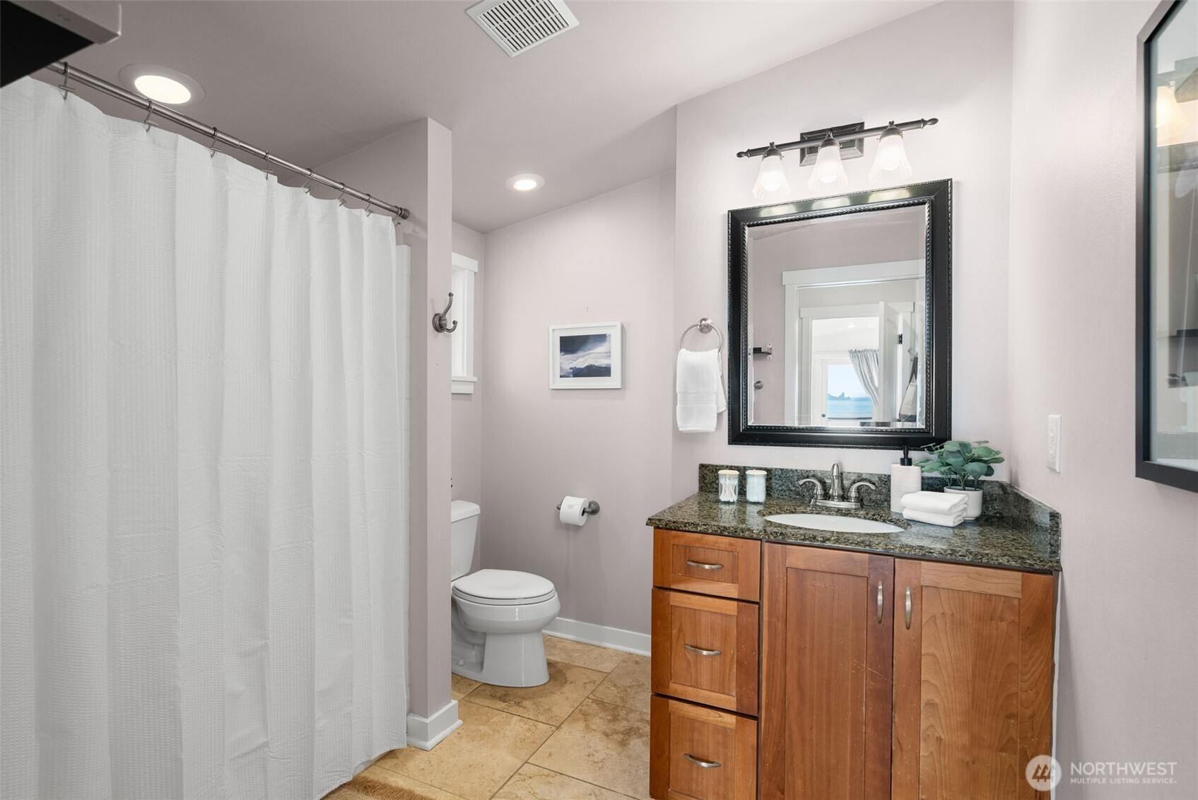 Updated bathroom with clean finishes and functional design.
