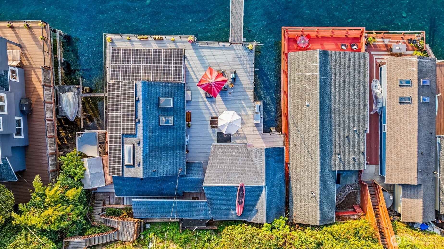 Close aerial perspective of the homes on pilings, perched directly above the Sound.