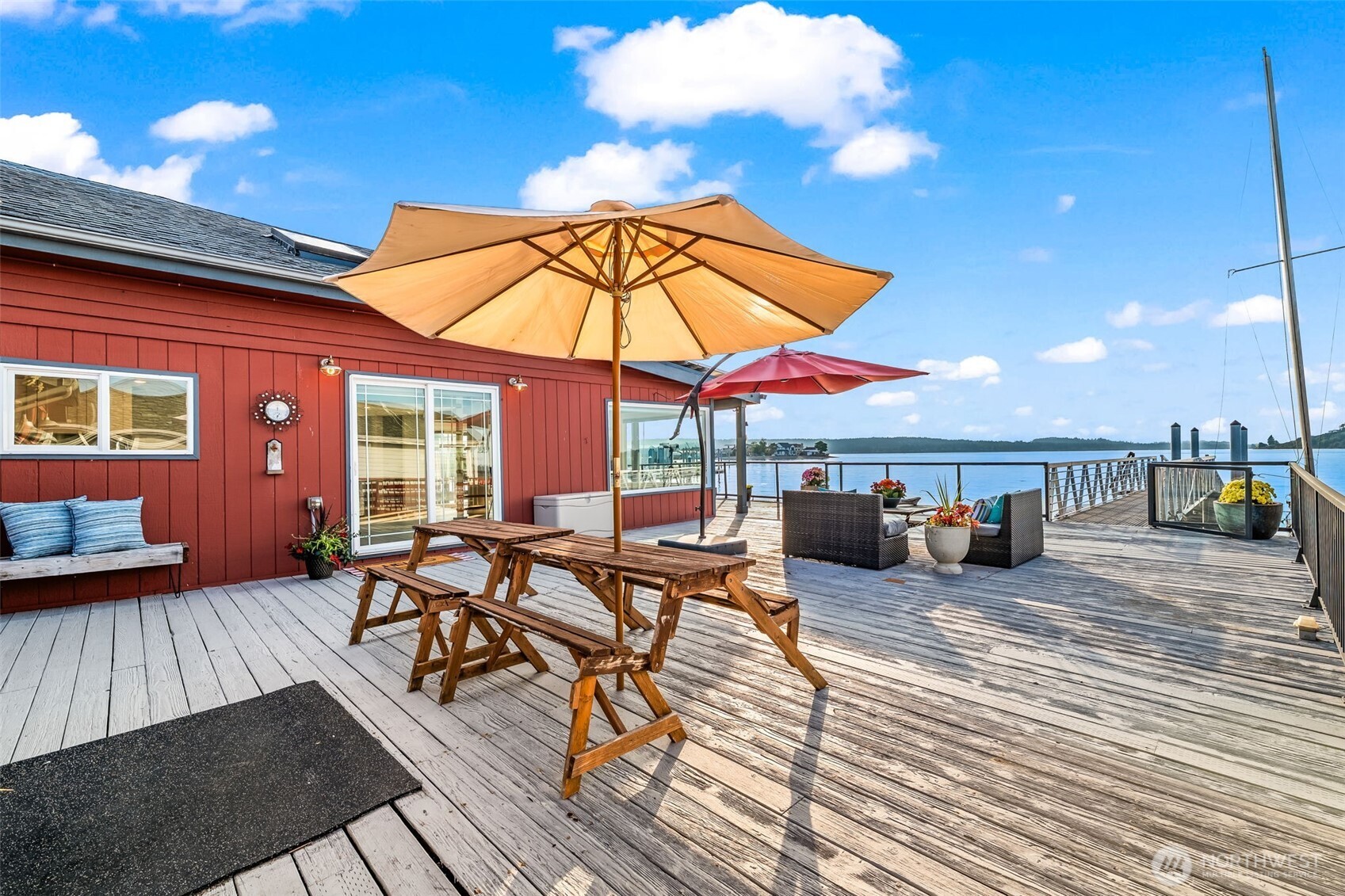 Multiple lounge and dining areas offer seamless indoor-outdoor living with sweeping views.