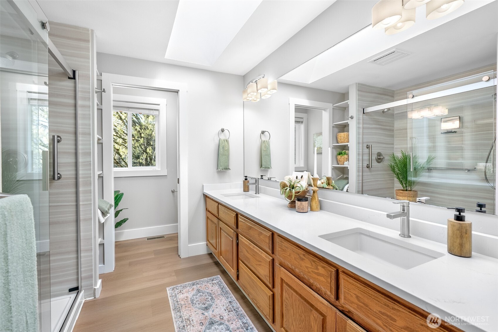 Primary bathroom with double vanity and updated shower.
