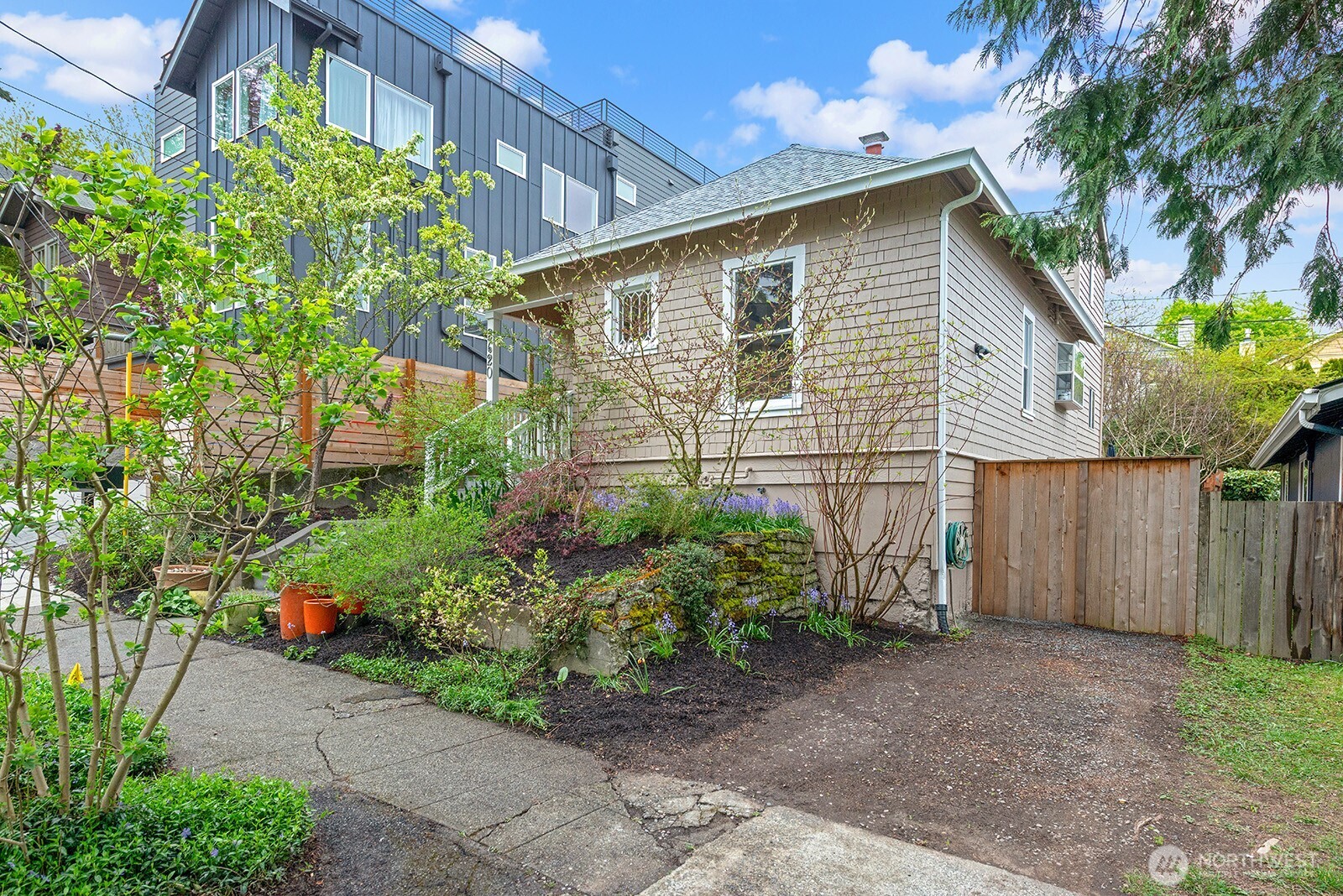 Off street parking and gate leading to the rear yard.