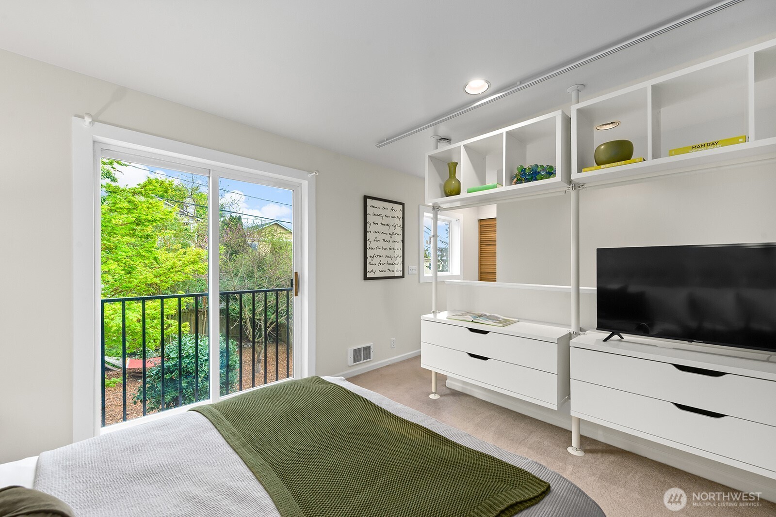 Primary bedroom has a lovely outlook over the rear yard.