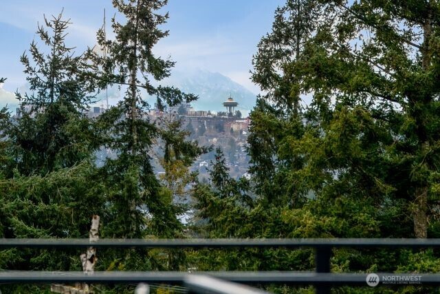 Rooftop view deck overlooking the Seattle Skylines, and mountains.