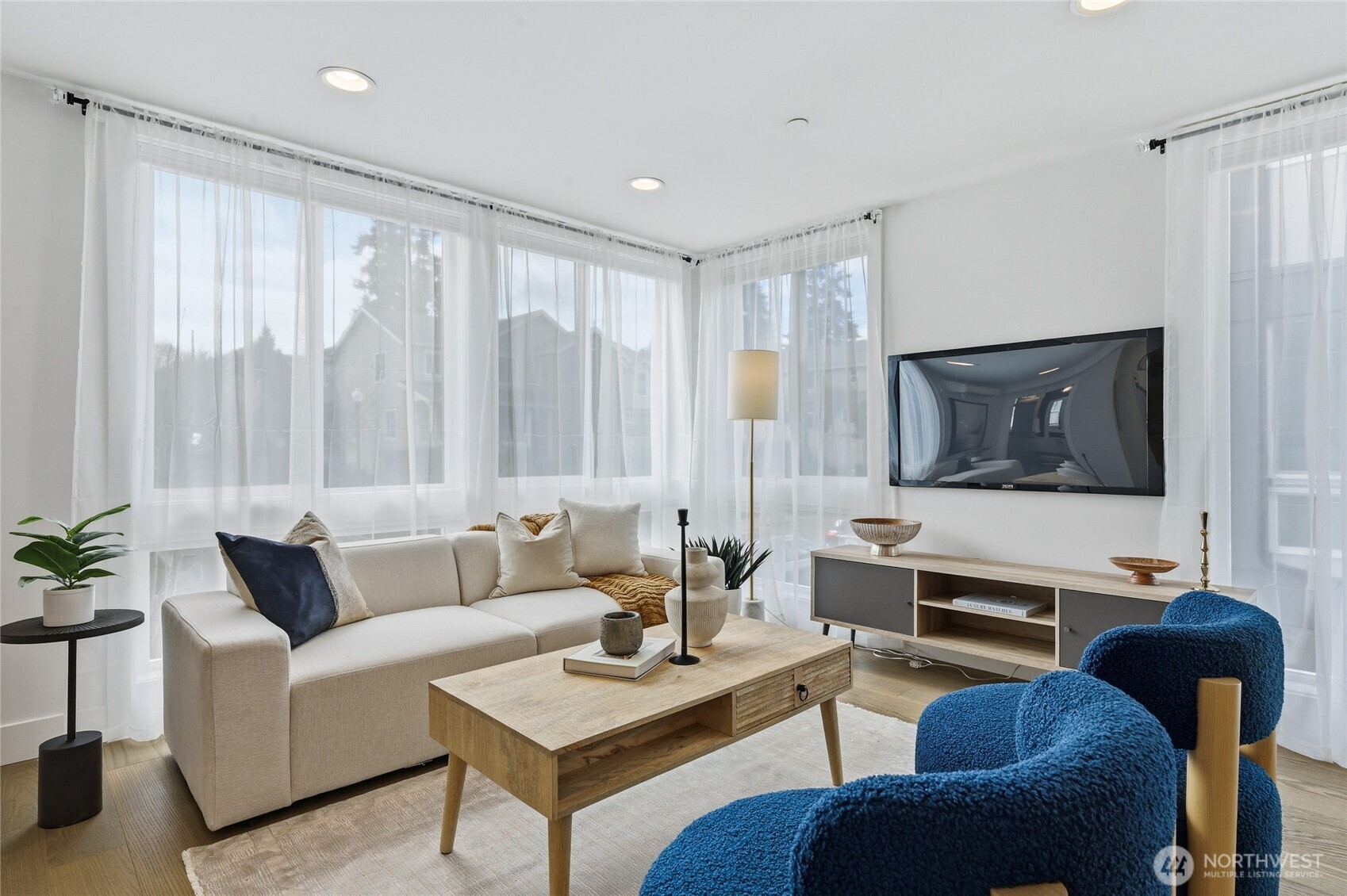 Open layout, floor to ceiling, windows and sunlit rooms