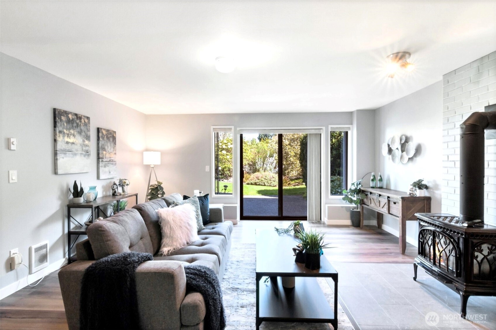 Huge lower level family room with high ceilings and slider d  oor to back yard