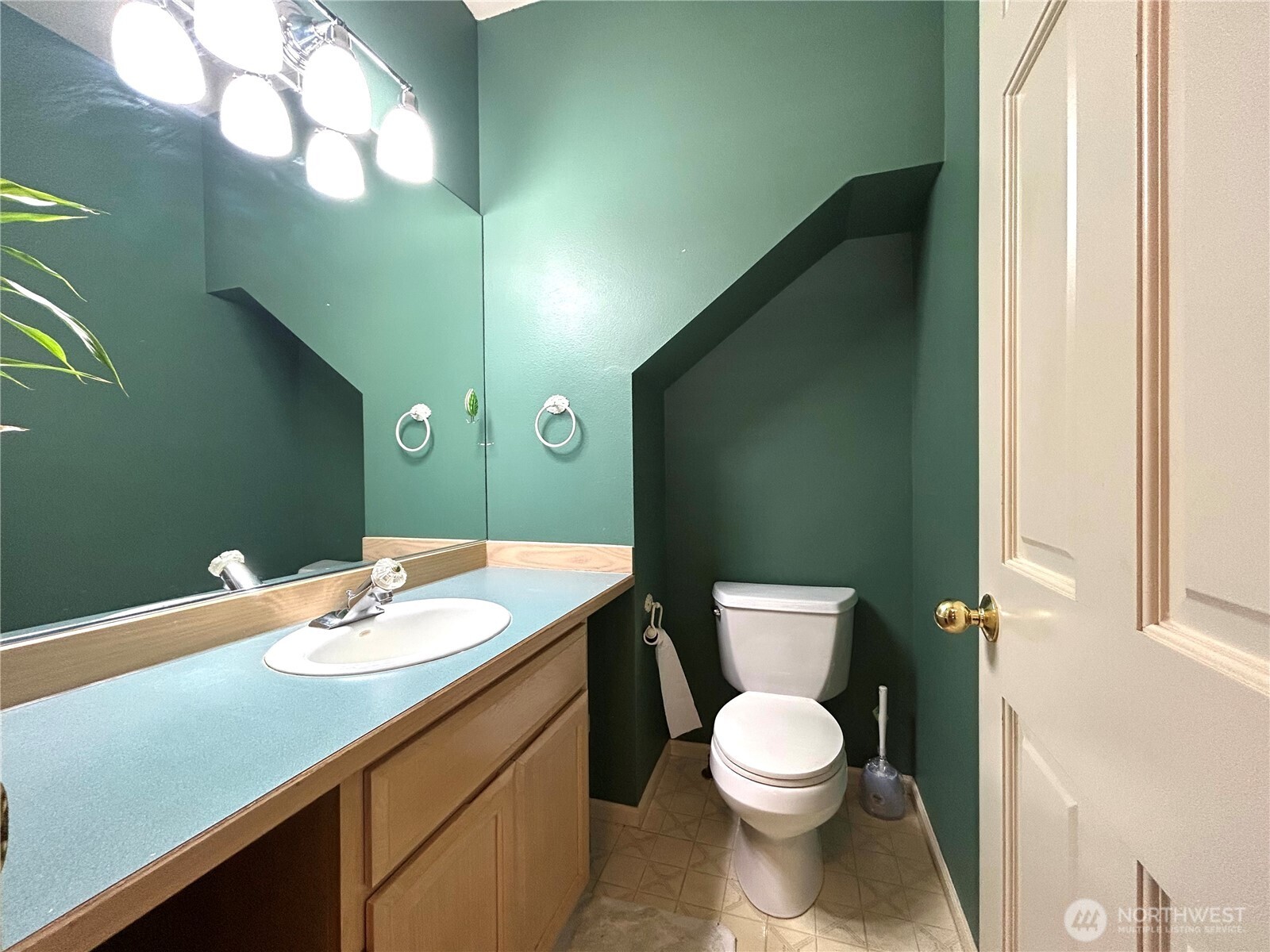half bathroom next to utility room