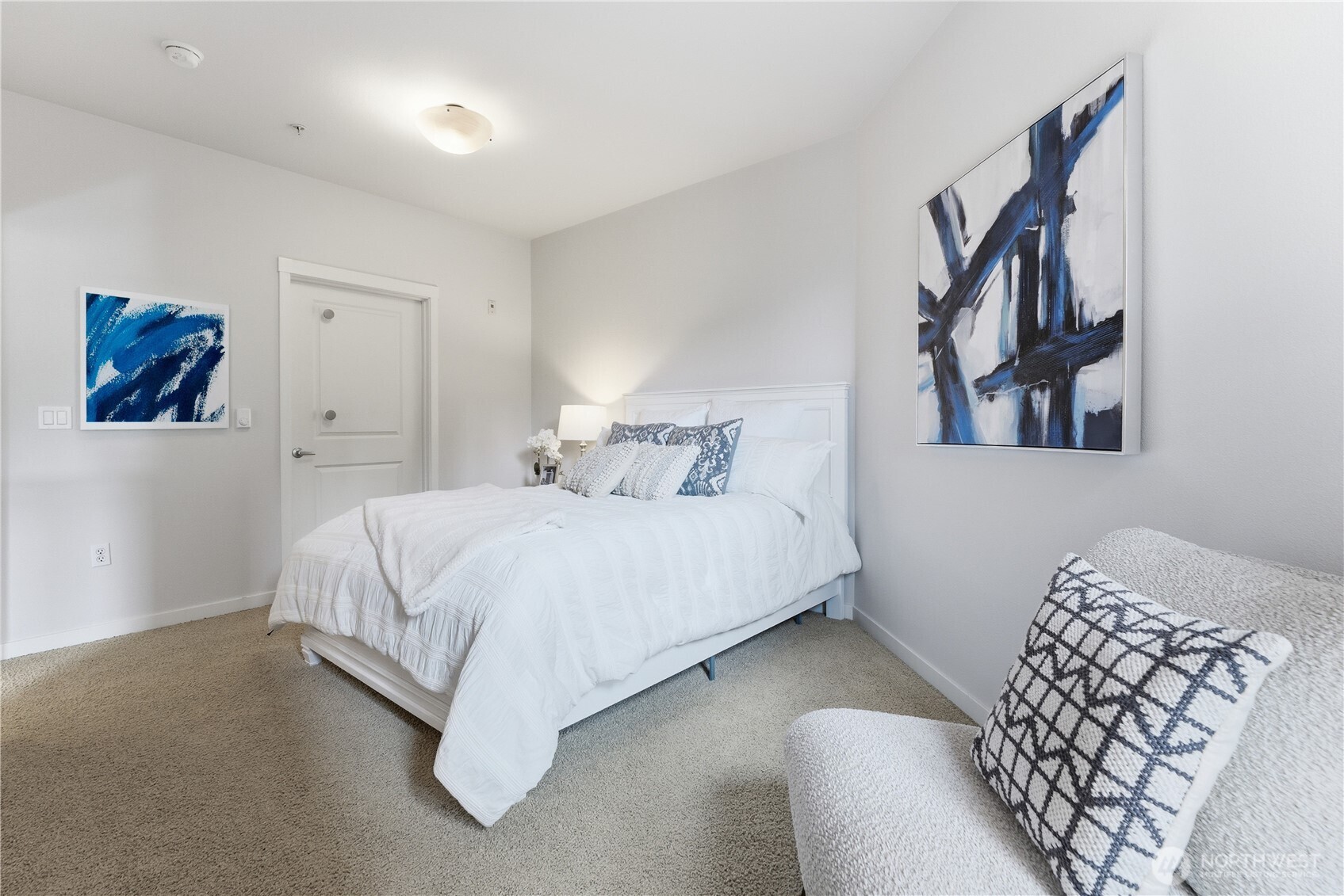 Bright bedroom with an adjoining door leading conveniently into the bathroom