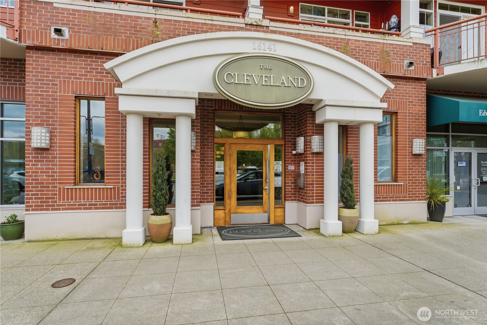 Stately, columned entryway welcoming you into The Cleveland’s secure, well-kept lobby