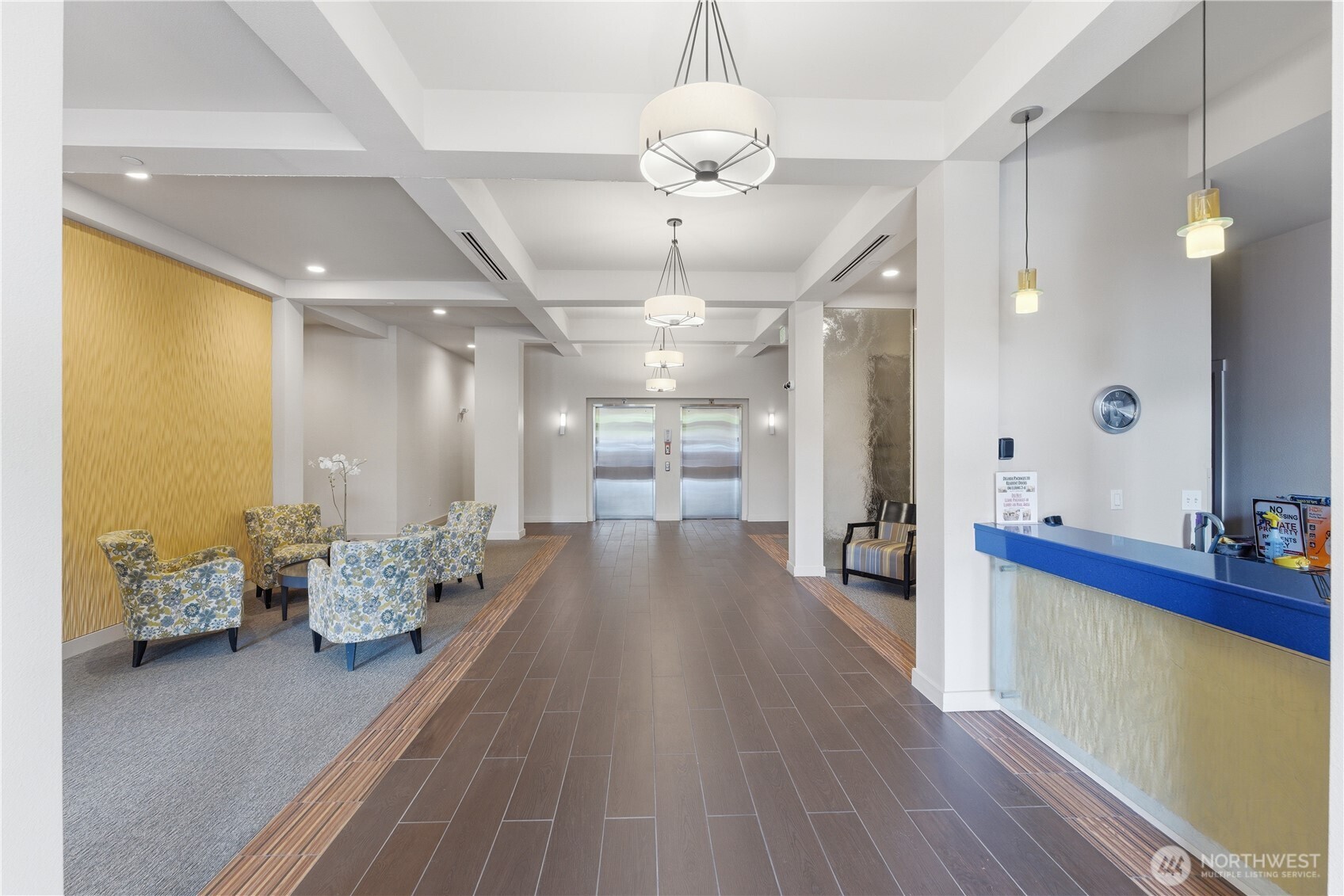 Inviting lobby entry with a clear view to the double elevators, offering easy access to every floor