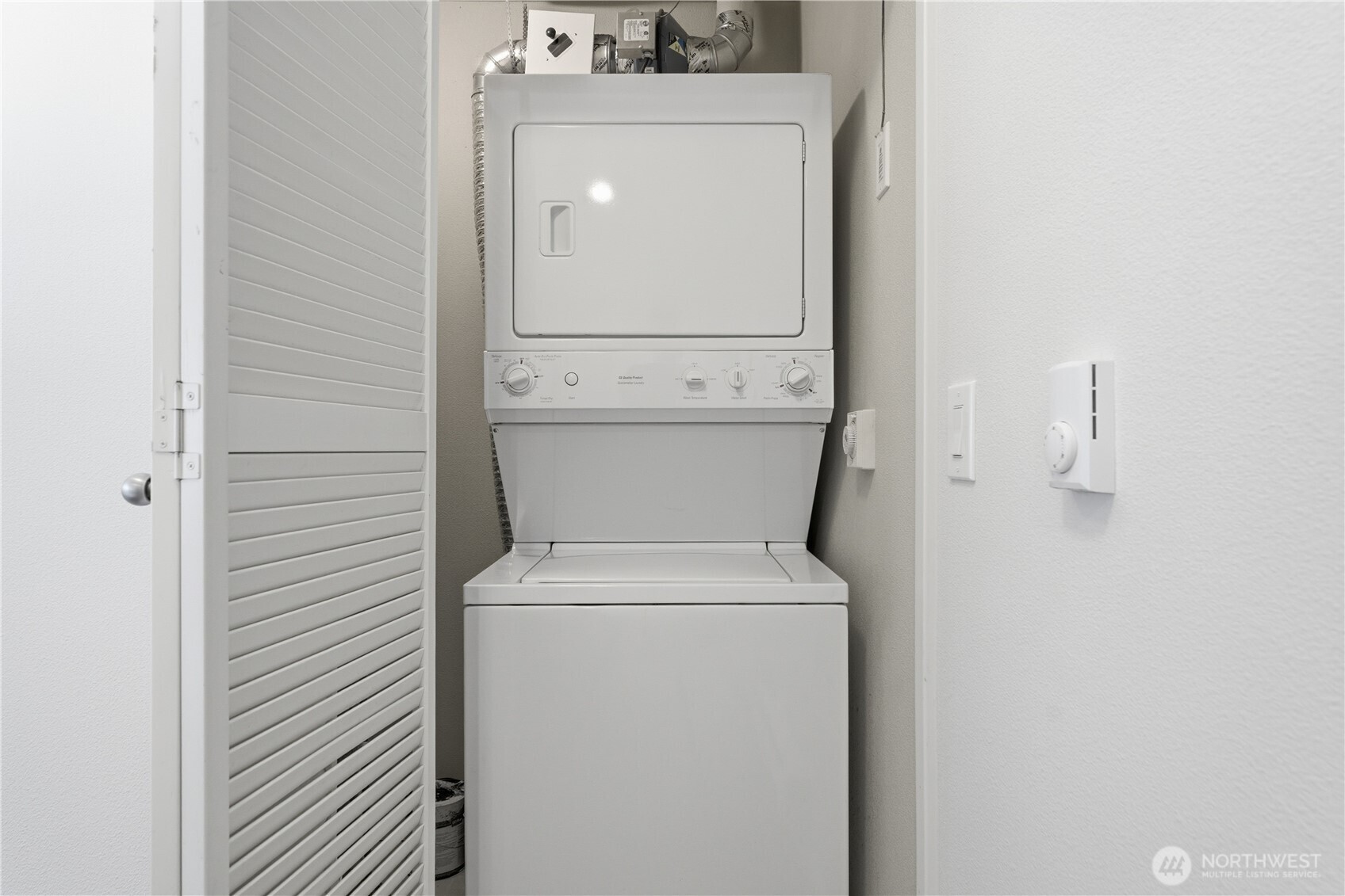 The newer, in-unit washer and dryer tucked behind double doors for easy, everyday convenience
