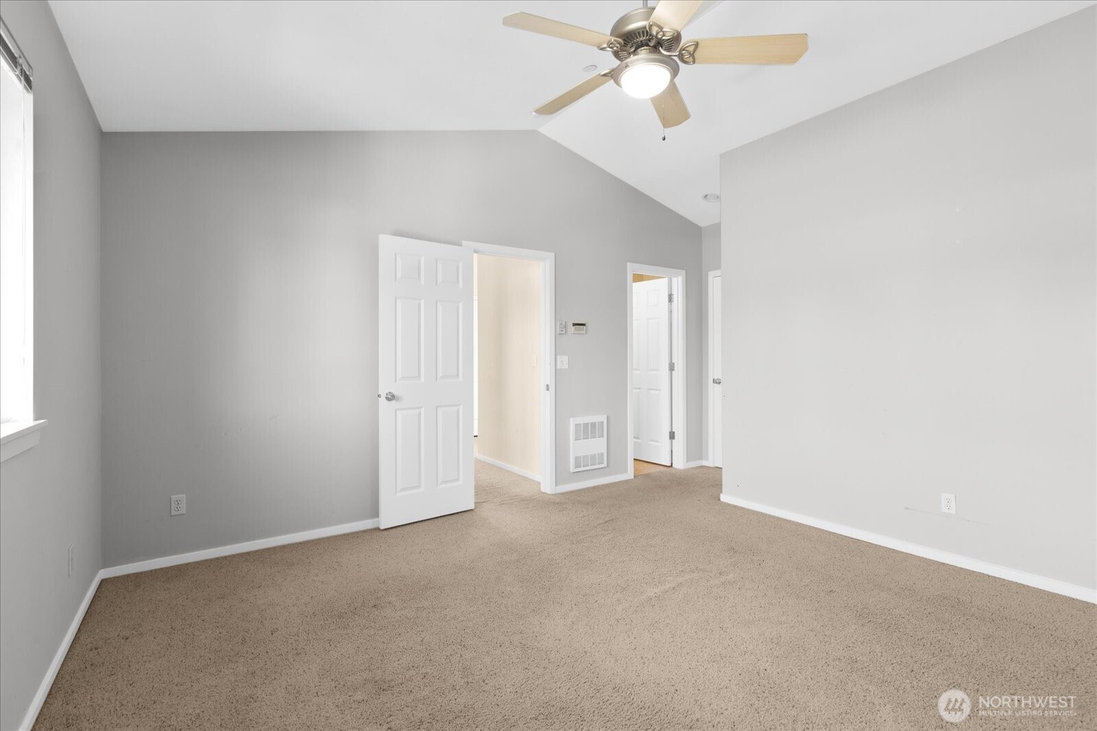 Another view of the primary bedroom.