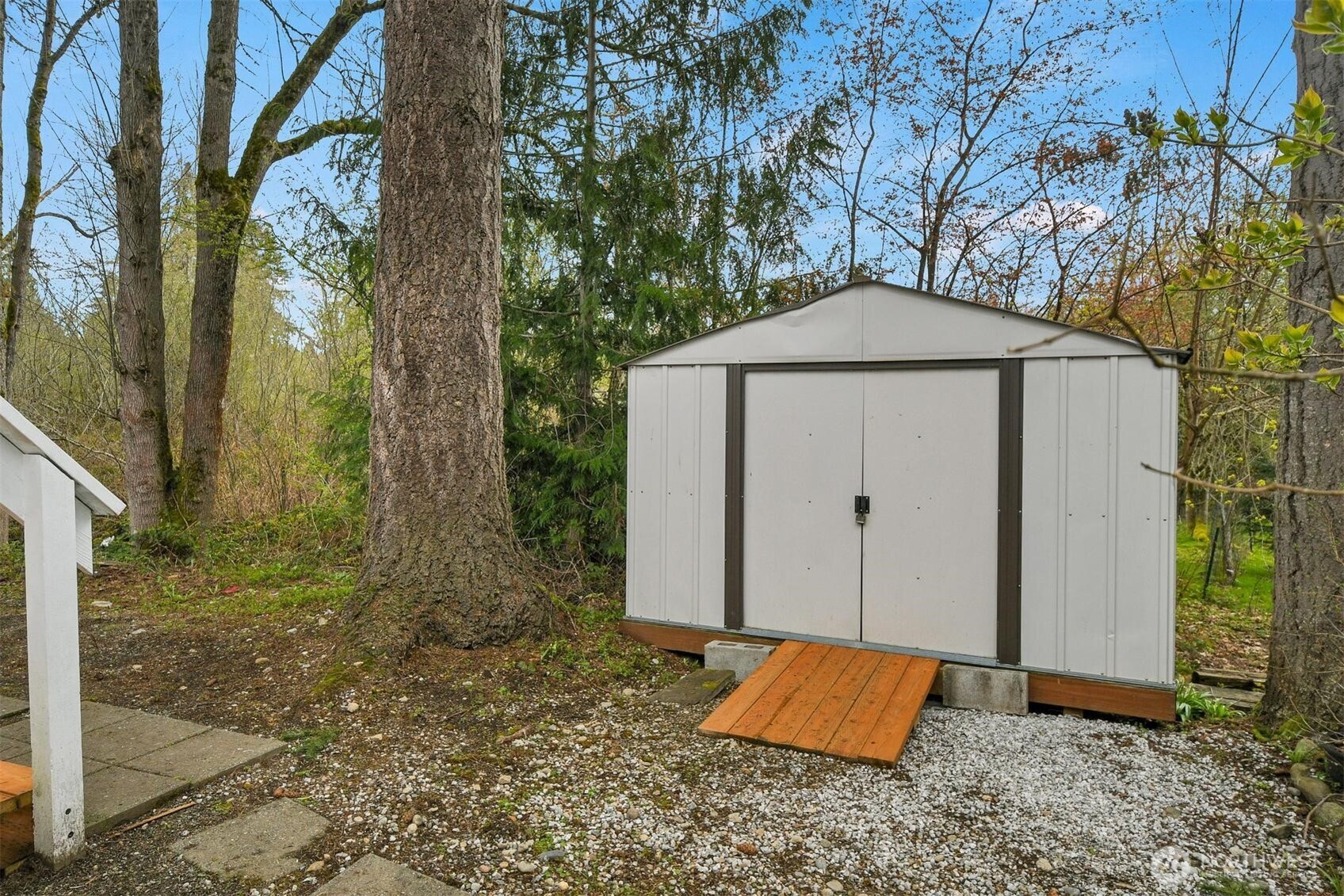 Handy storage shed stays with the home.