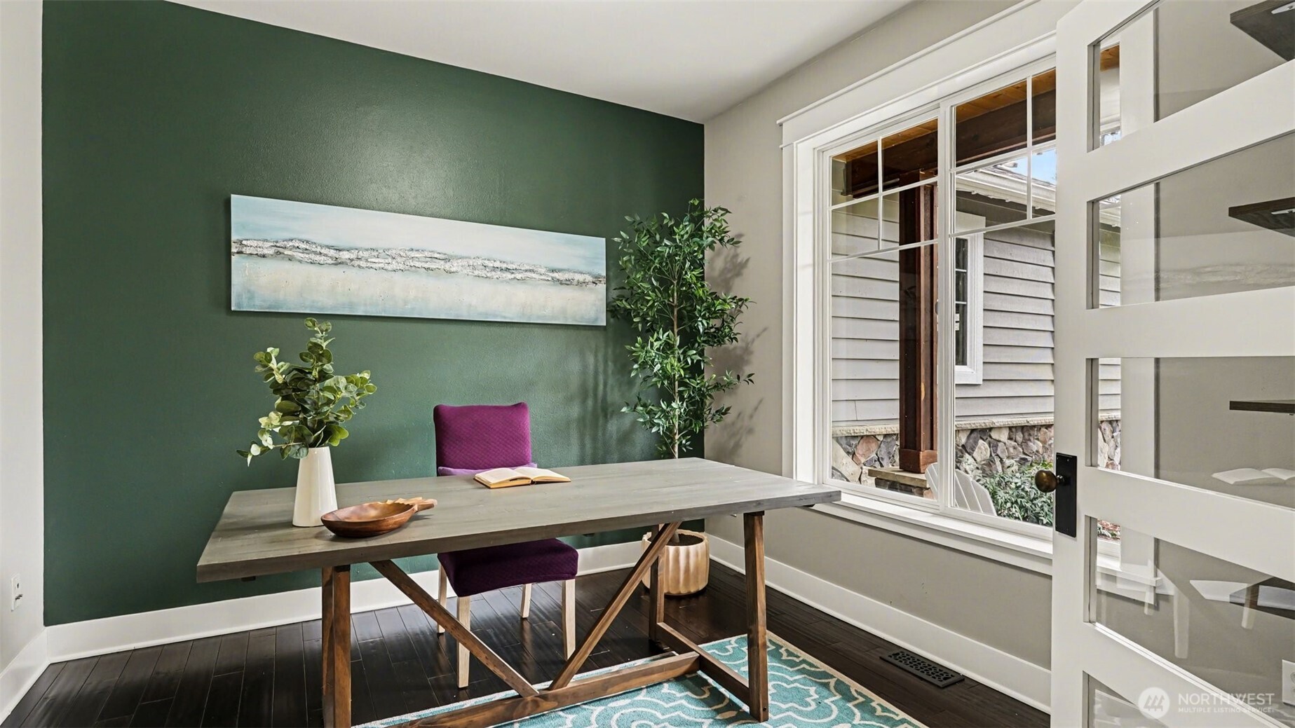 The main floor office features French doors and views of the front yard & porch.