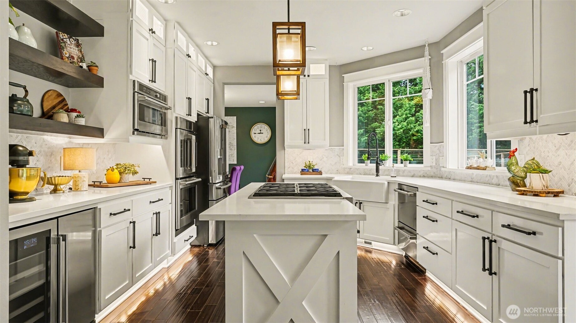 Quartz countertops, floating shelves, lighted cabinets & Cafe appliances make this a dream kitchen.