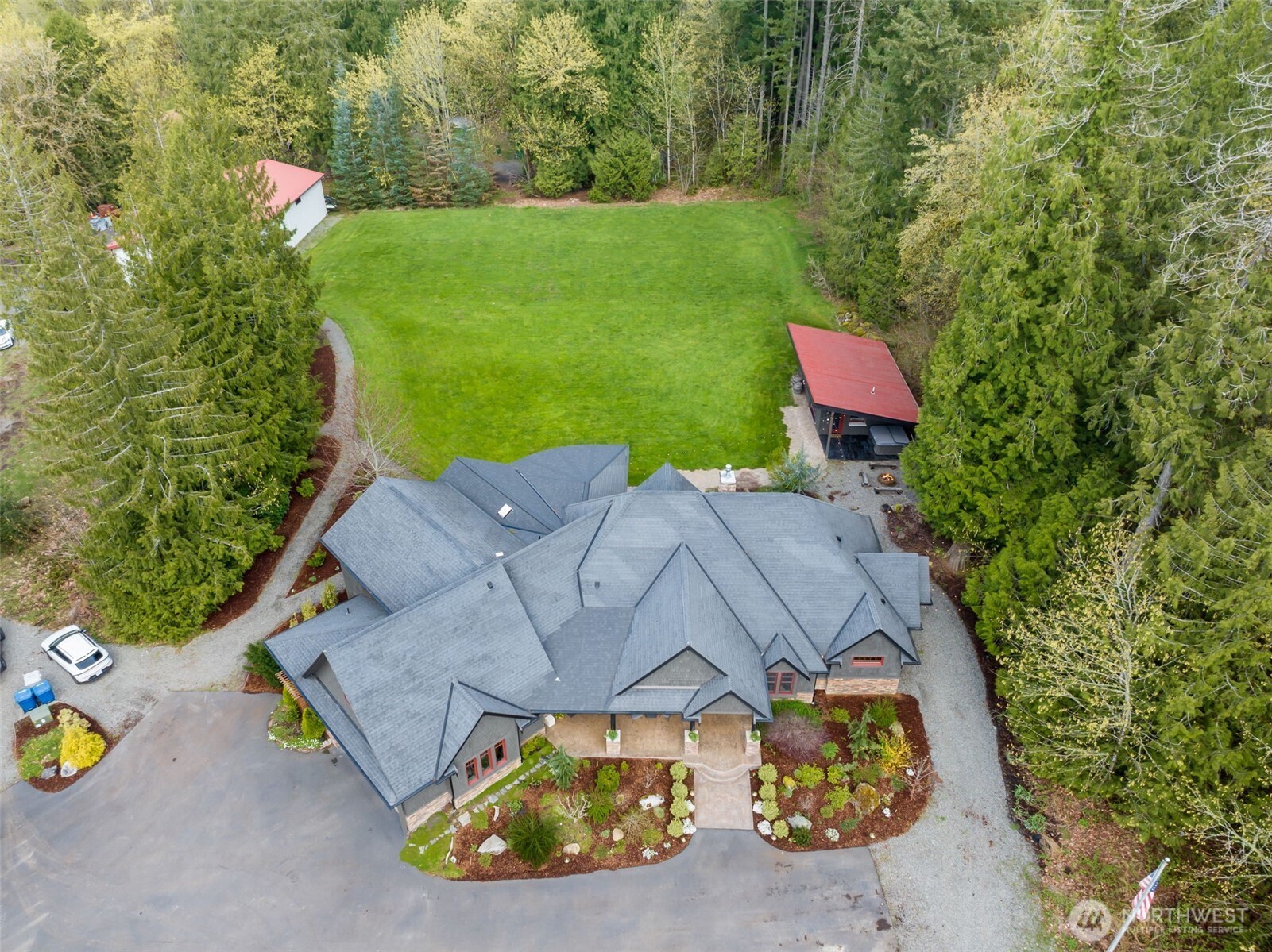Set on 10 beautiful acres, this remarkable estate includes the main home, extensive outdoor living spaces, a detached cabana/ADU studio, additional lawn and garden areas, and a substantial 3,200 sq ft detached shop.