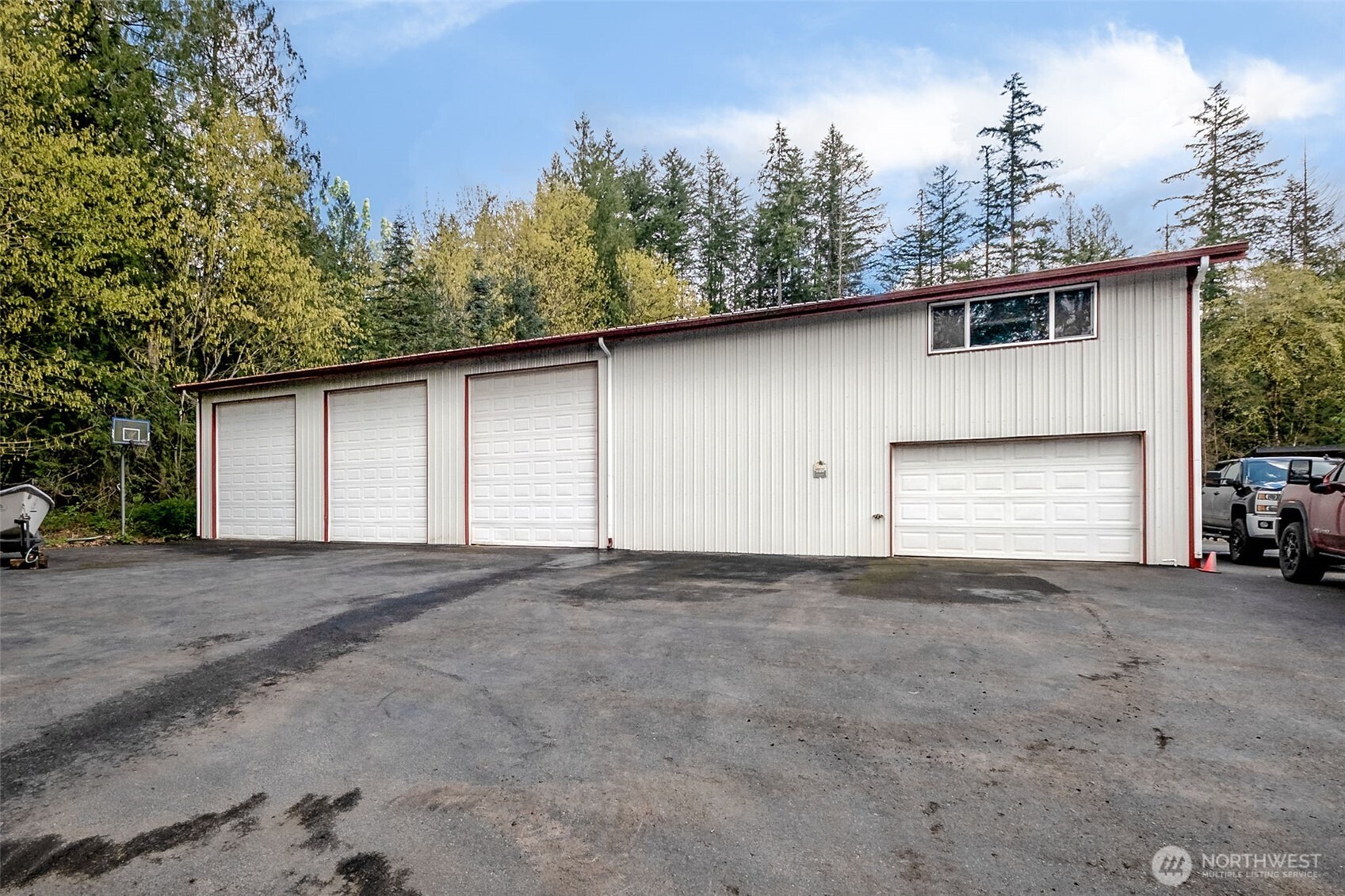 The impressive 40' x 80' detached shop offers exceptional utility, featuring multiple bay doors, a mezzanine level for additional storage, and a fully finished upper-level office complete with two private workspaces and a bathroom—ideal for business, hobbiest (car lovers!?) or large-scale projects.