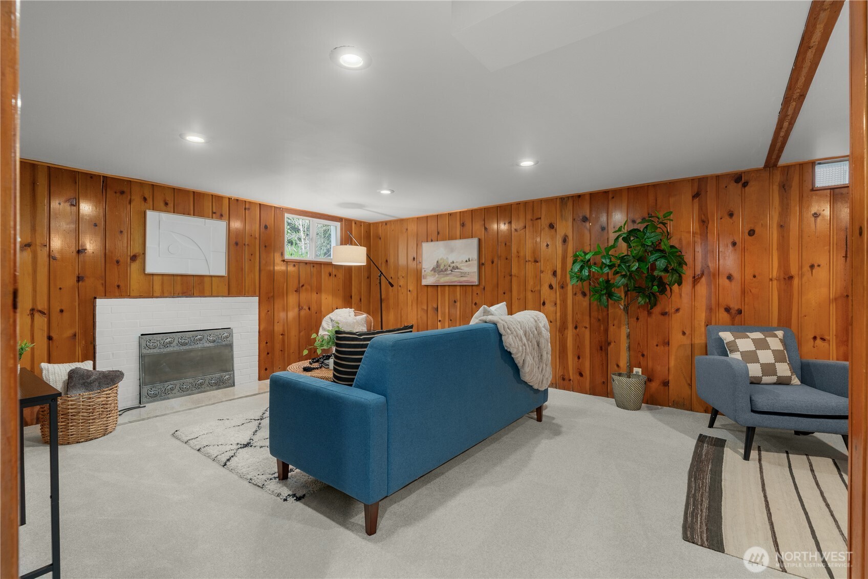 Enormous downstairs den with fireplace, storage, and more charm than you can shake a stick at.