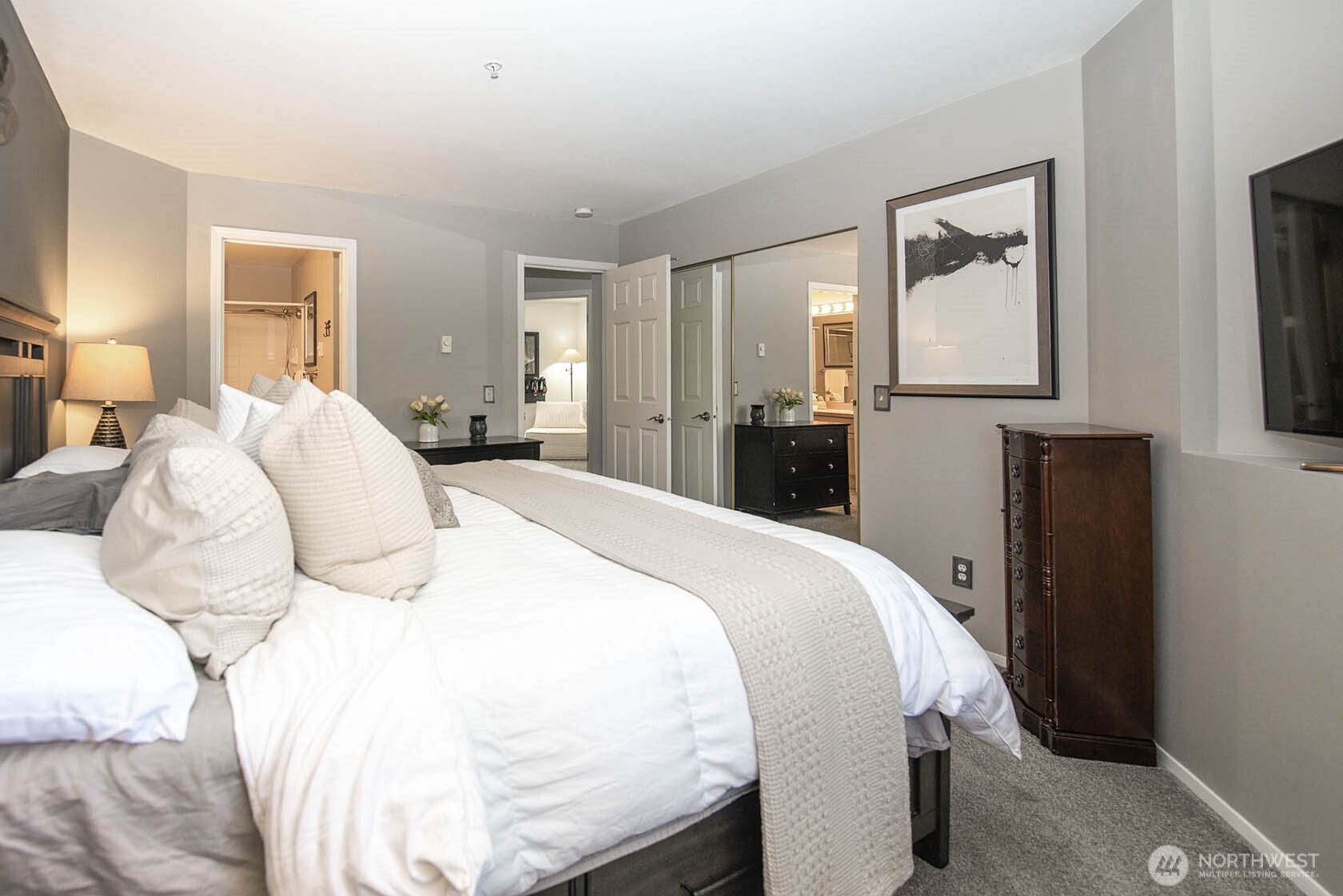 Primary bedroom looking toward entry to primary bath and hallway