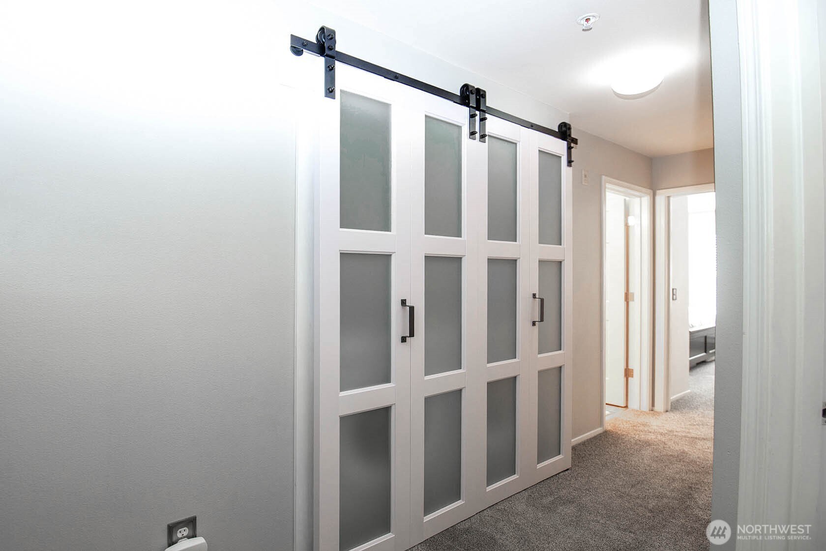 Laundry, with door closed, in hallway