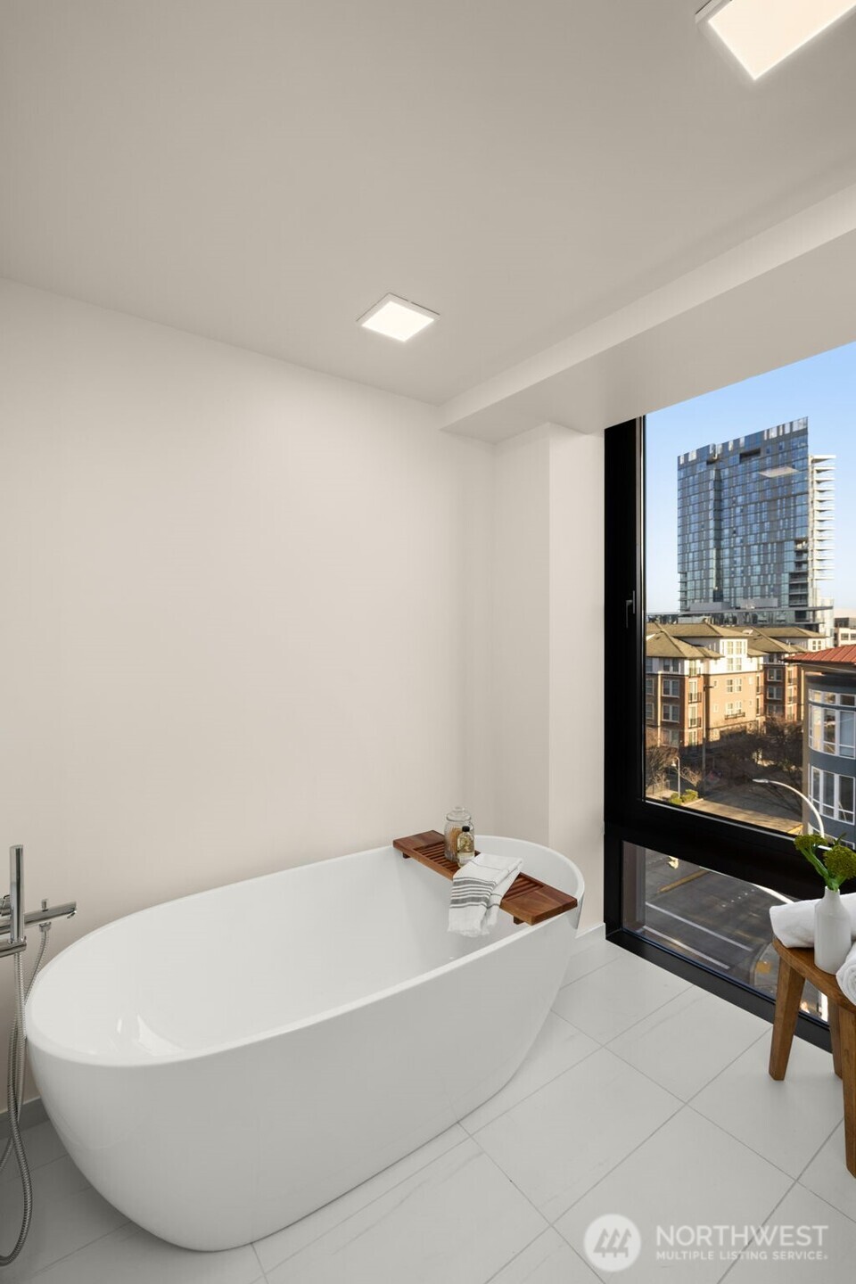 Soaking tub with a view and heated flooring.