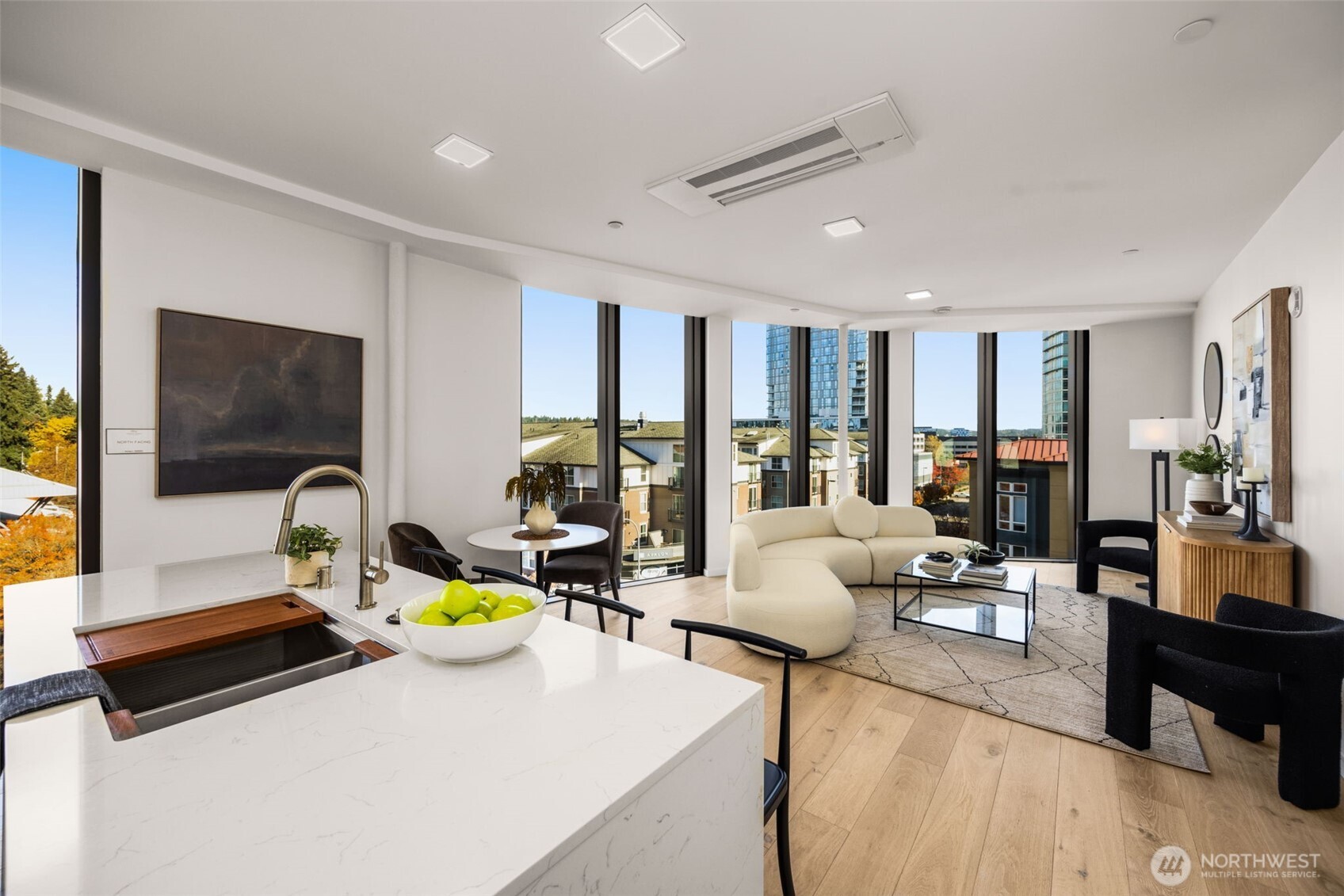 Waterfall quartz island with floor to ceiling windows.