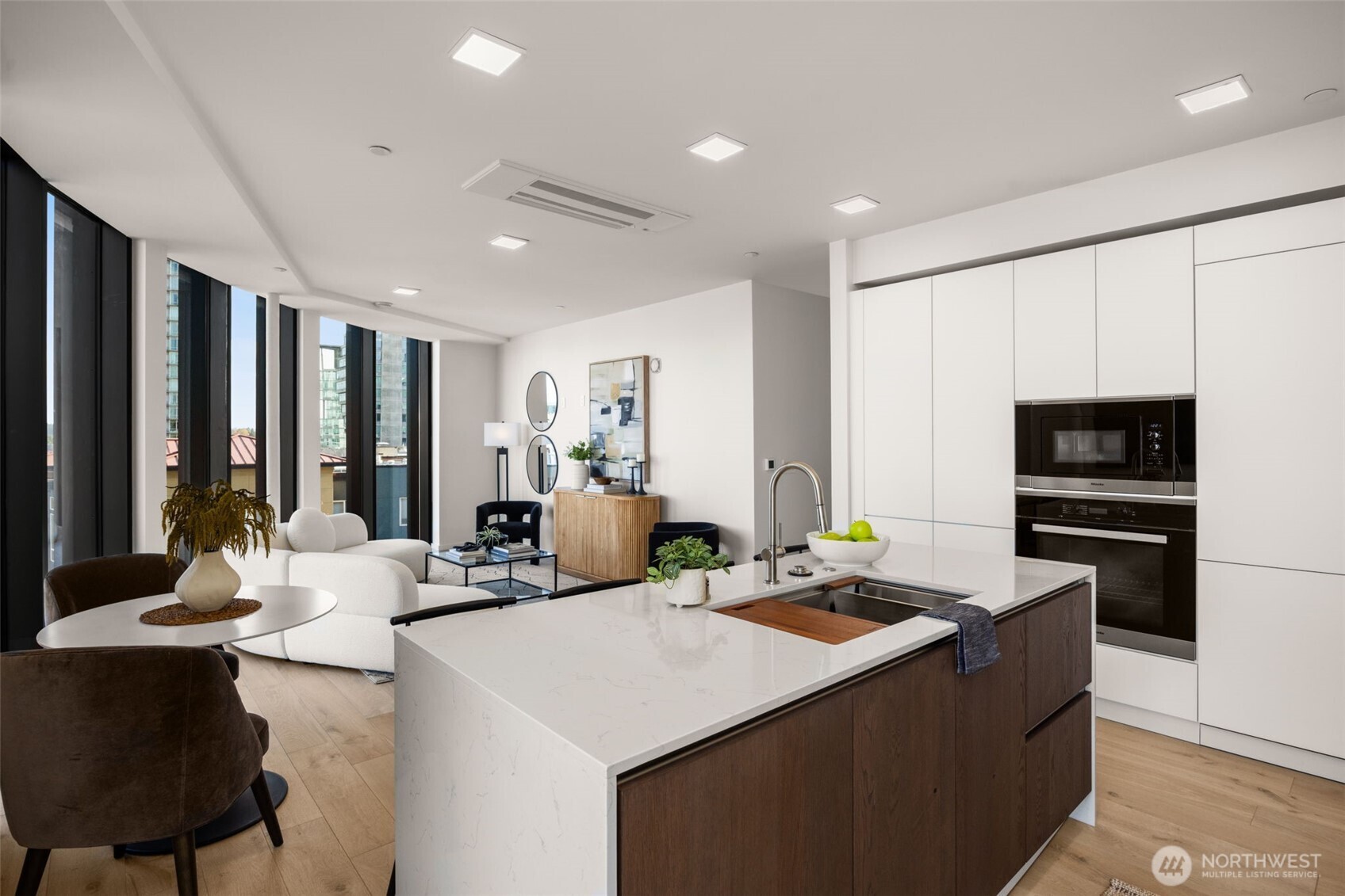 Custom smart glass cabinetry and Miele Appliances.