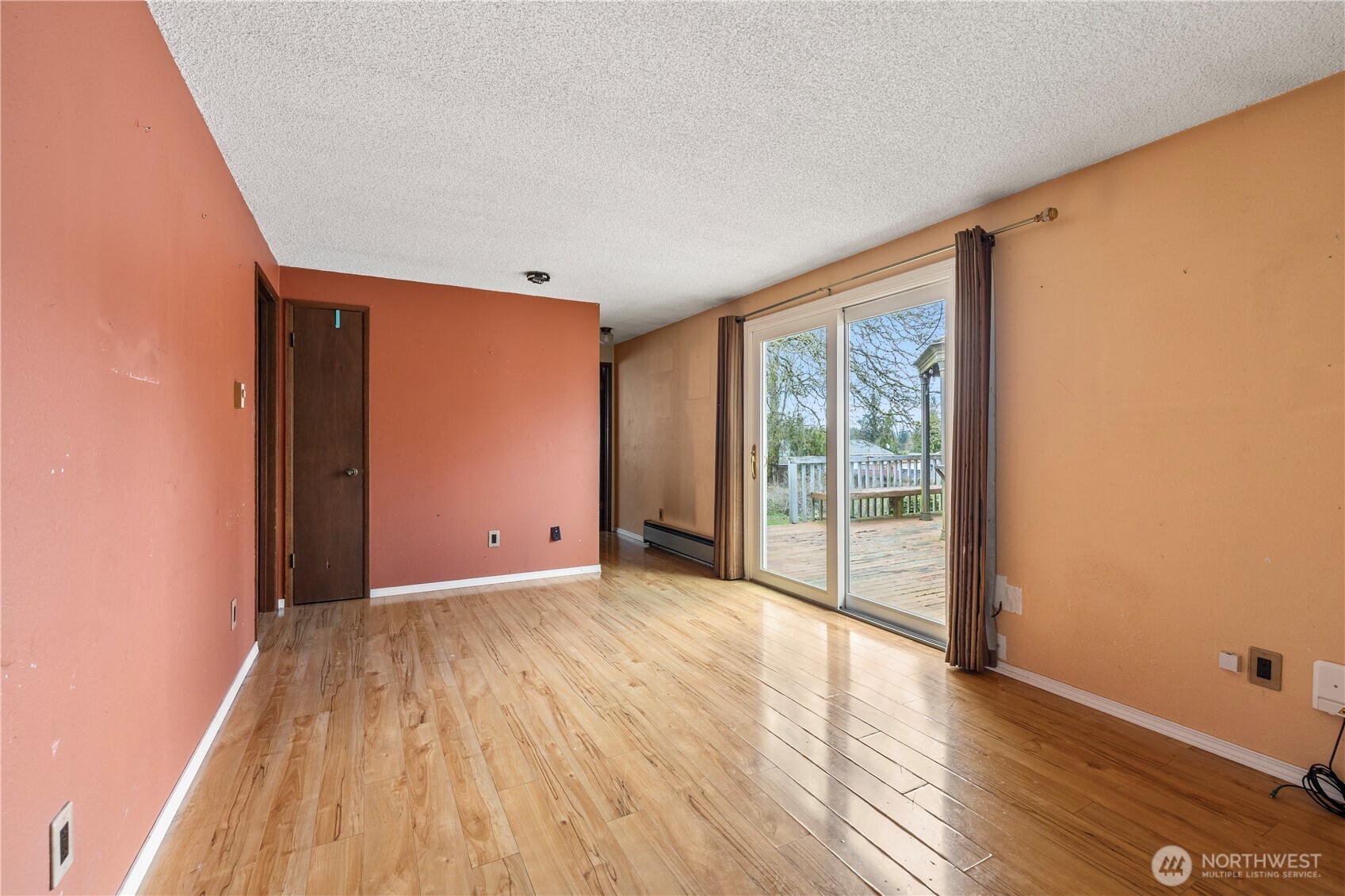 Great room with slider onto back deck.