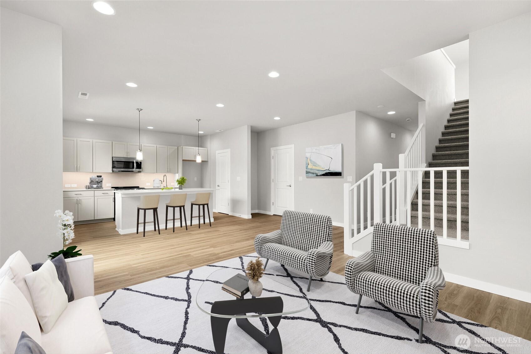 All photos are for representational purposes only. Actual finishes and colors will vary. Open concept with living room and kitchen with walk-in pantry. Virtually staged.