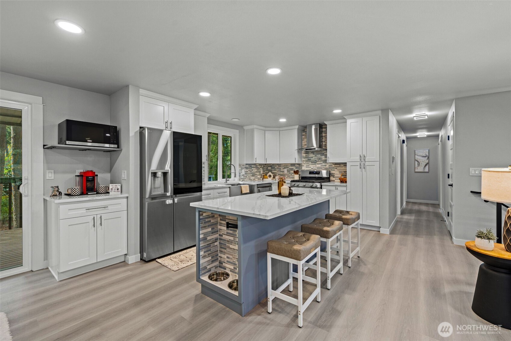 Look at this kitchen with white and grey shaker cabinets, dog food station and espresso station! This is a show stopper!!!