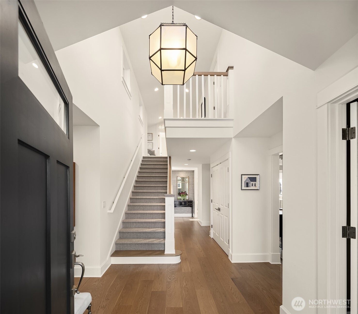 A two story entry with great volume greets you. luxury lighting from Urban Electric, Mitiz,Amber Lewis, RH define the spaces with style.