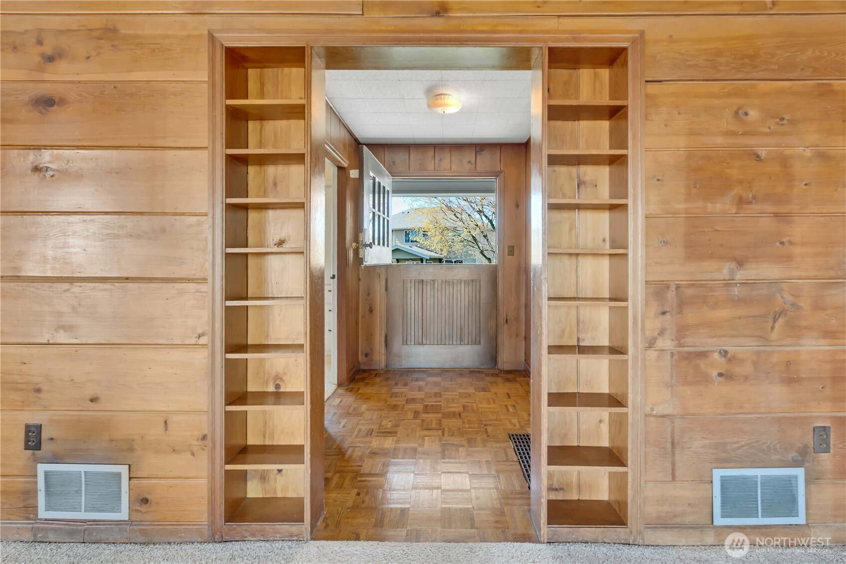 Front door opens into hallway with real paquet flooring. Notice the dutch-door.