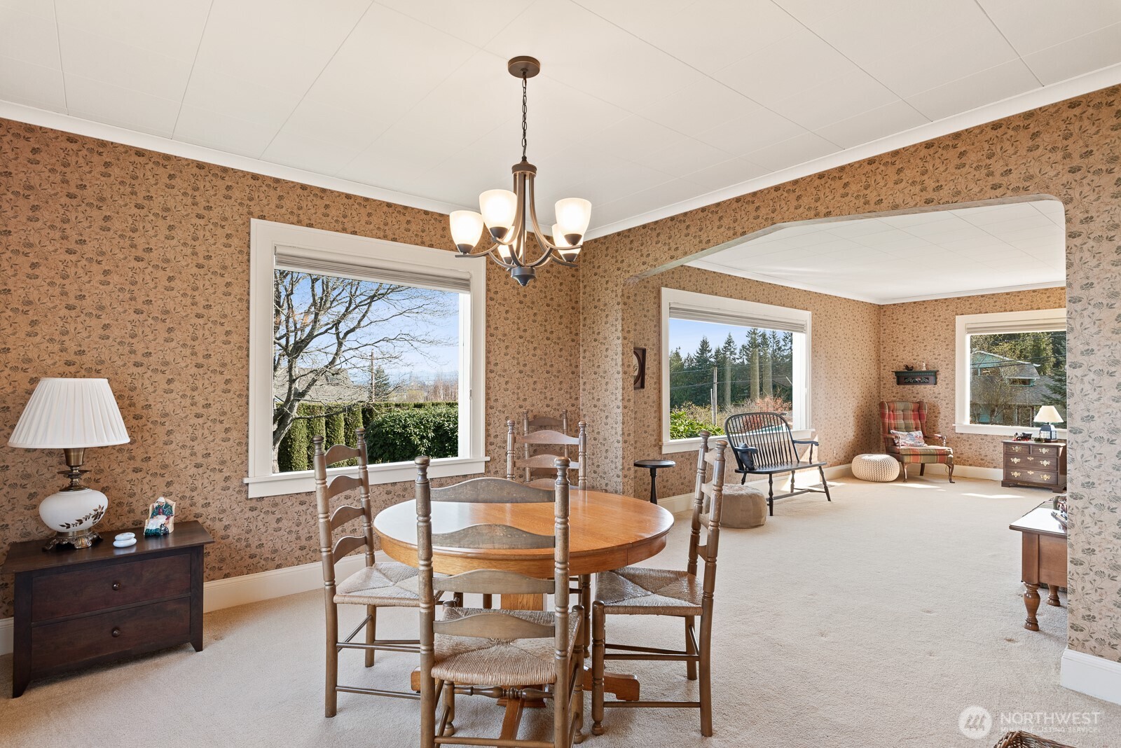 Dining room open to living room by charming arch