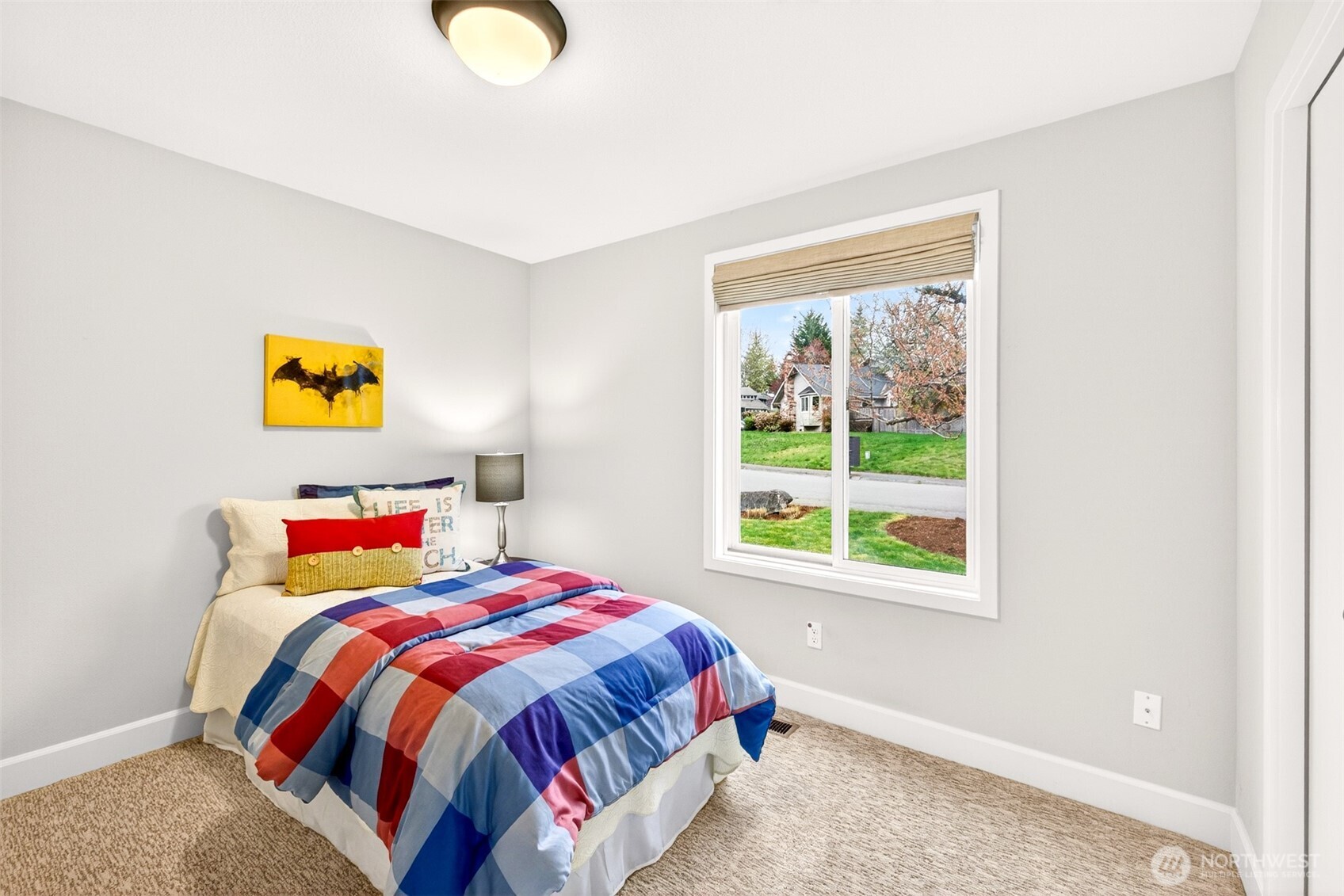 Bright, well-proportioned bedroom looks out over the front yard and quiet cul-de-sac street — a pleasant, low-traffic setting that gives this room a cheerful daytime ambiance. Updated carpet and interior paint make it a clean, comfortable space ready for whatever you need it to be.