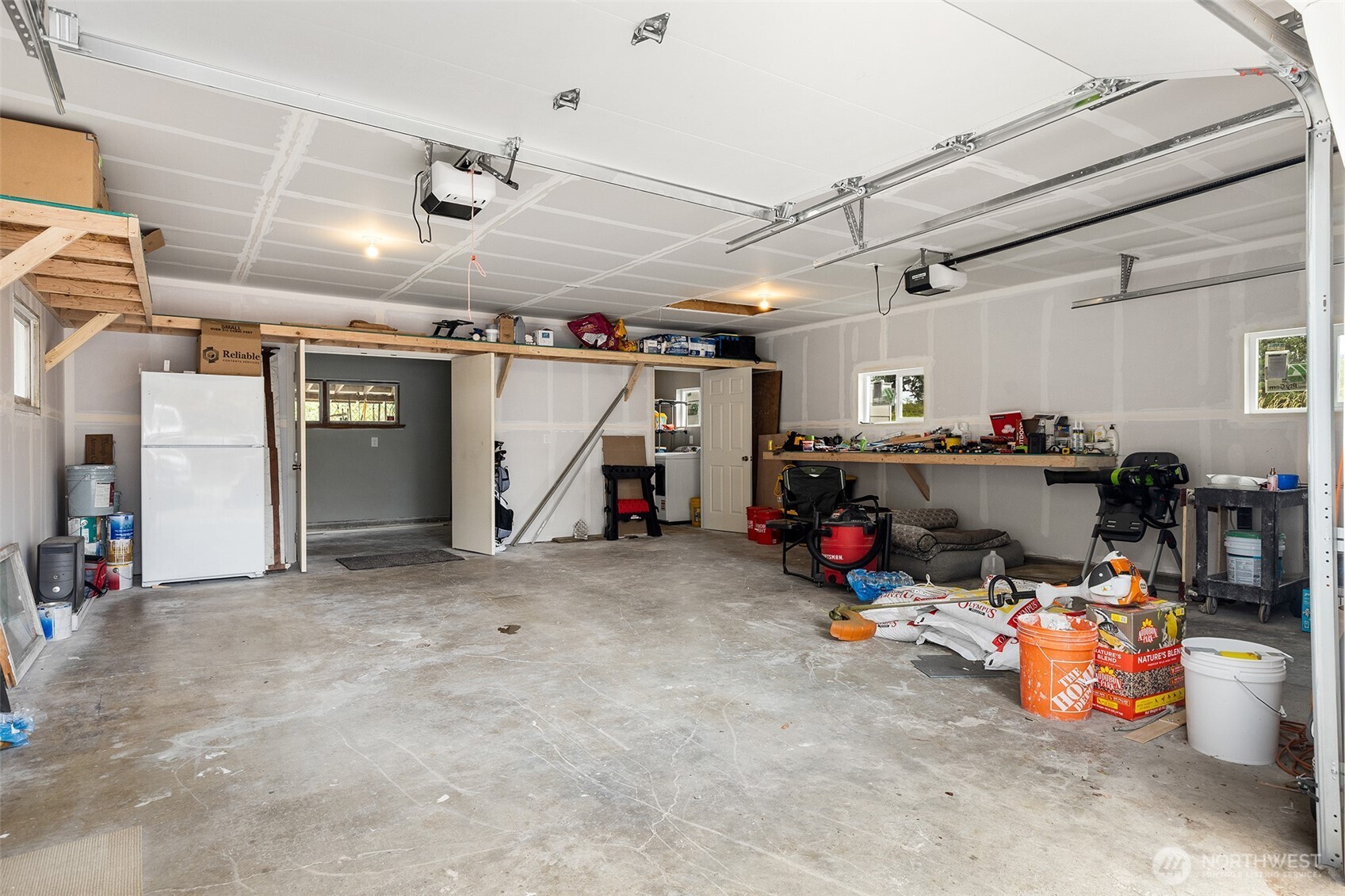 ~Spacious oversized 2 Car Garage w/ 2 Rooms ~ Utility room to the right & Work Shop/Hobby Rm to the left~ Lots of Storage~