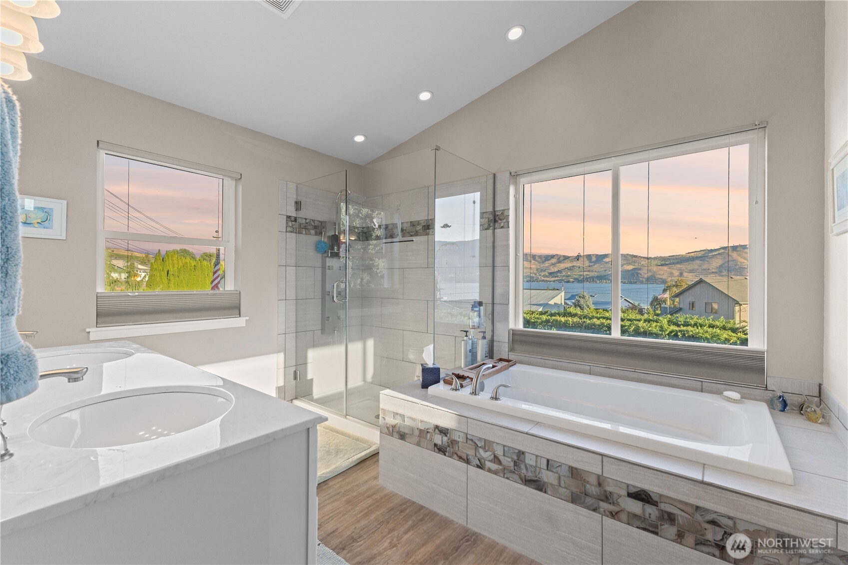 Primary bath with soaking tub and lake views