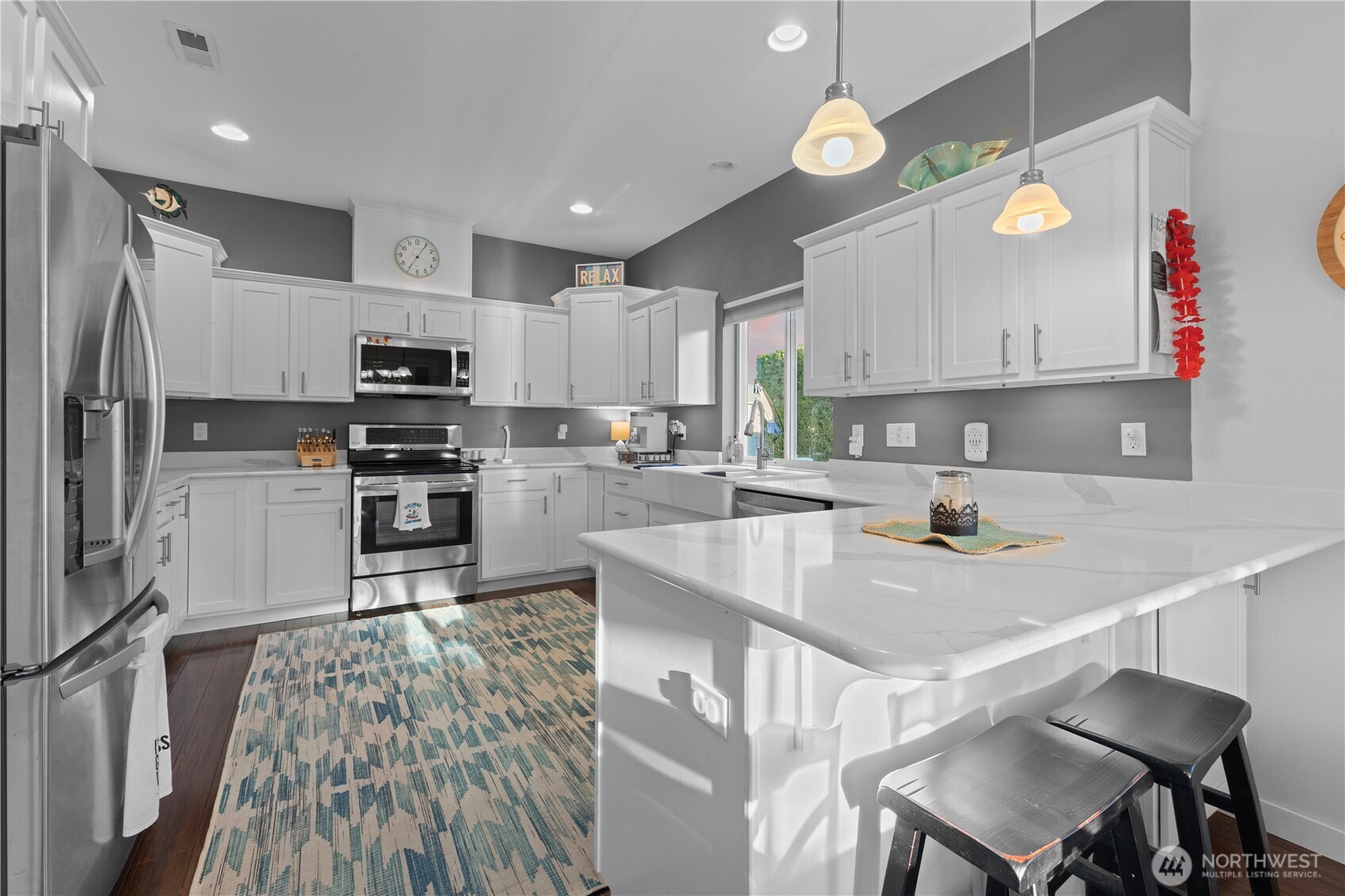 Updated kitchen with granite counters, stainless steel appliances & recessed lights